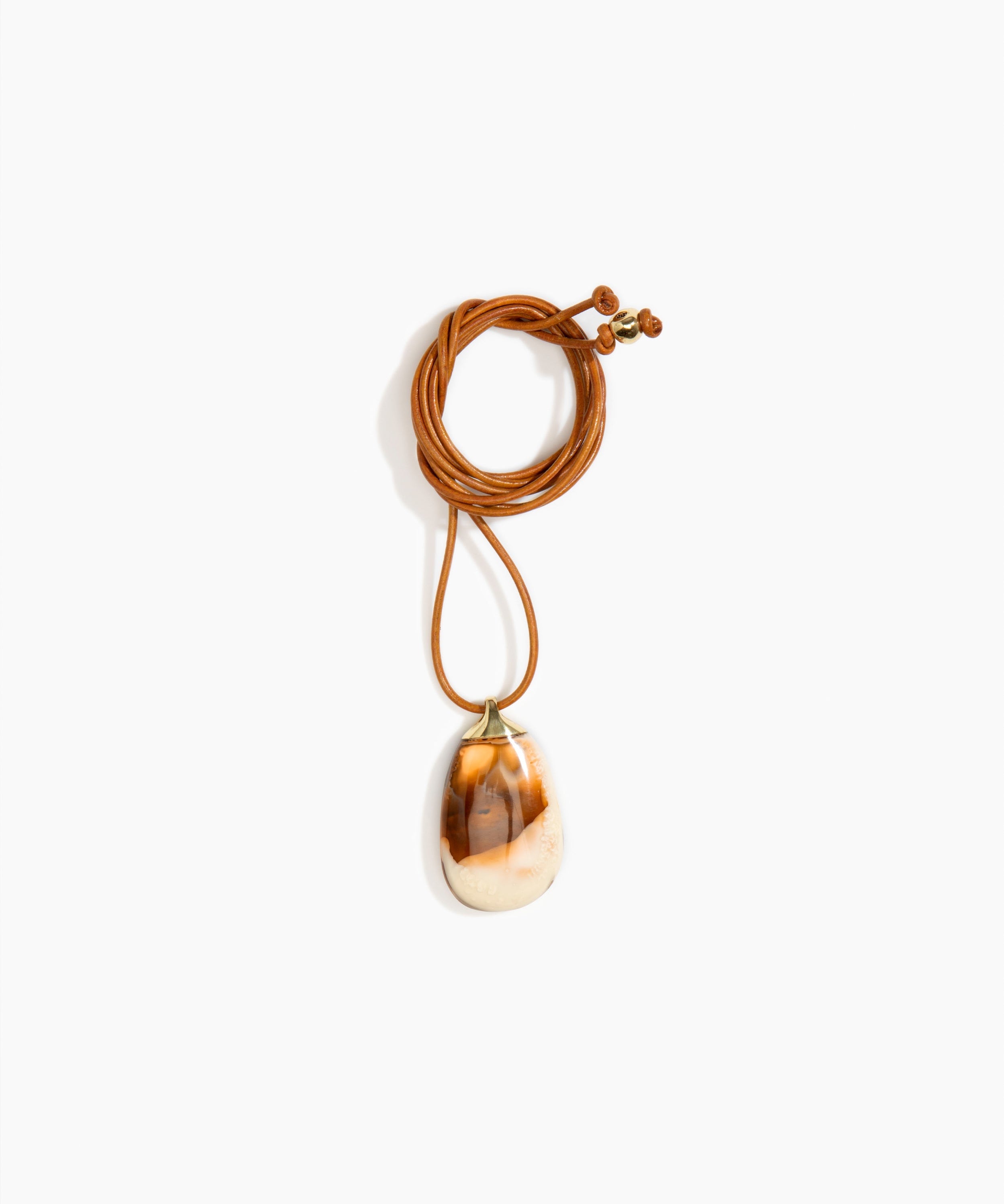 Dinosaur Designs River Rock Pendant on Leather in Light Horn Colour resin