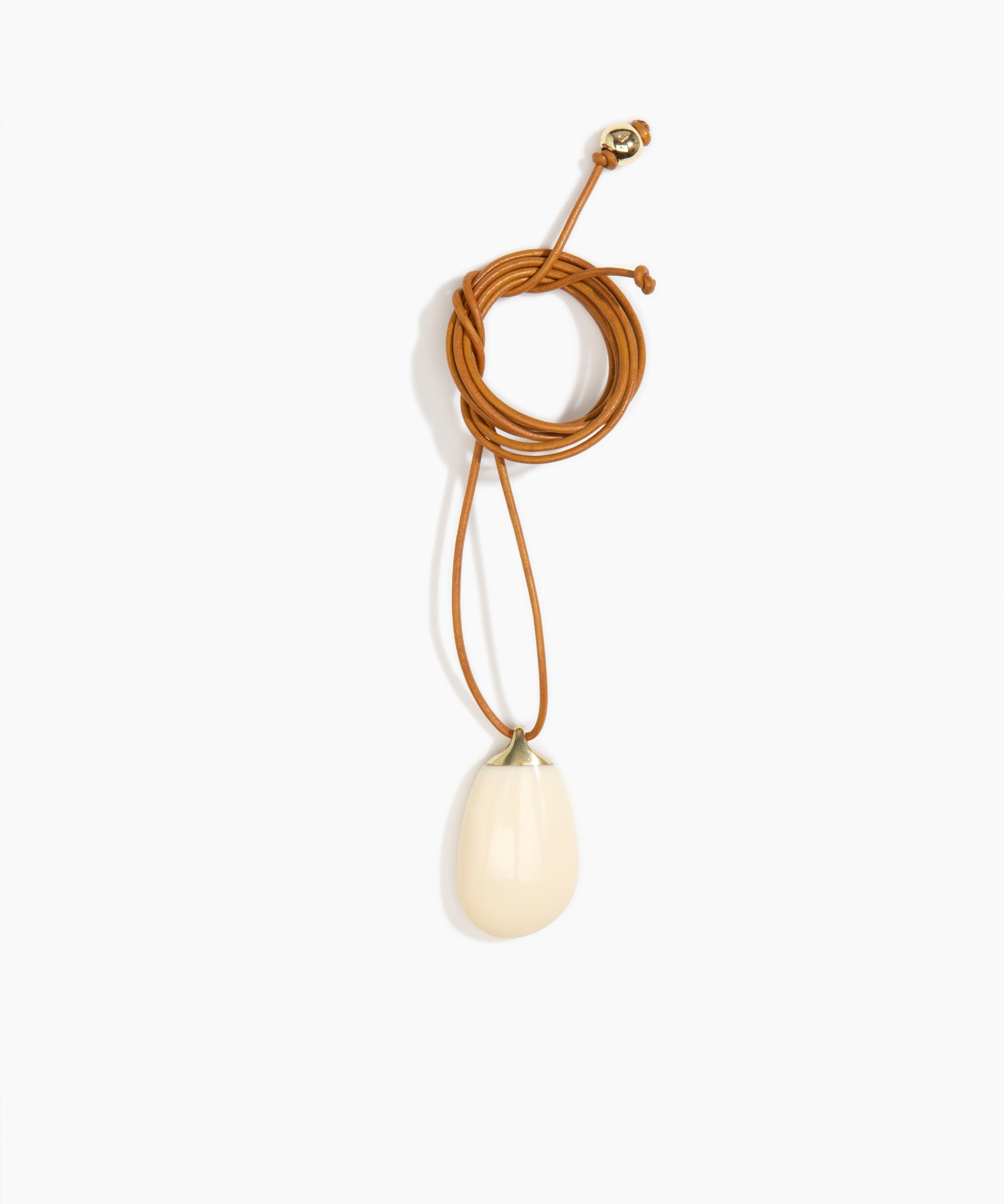 Dinosaur Designs River Rock Pendant on Leather in Cream Colour resin