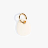 Dinosaur Designs Earth Keyring in Cream Colour resin with Brass Metal