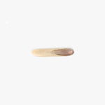 Dinosaur Designs Stone Butter Knife in Sandy Pearl Colour resin