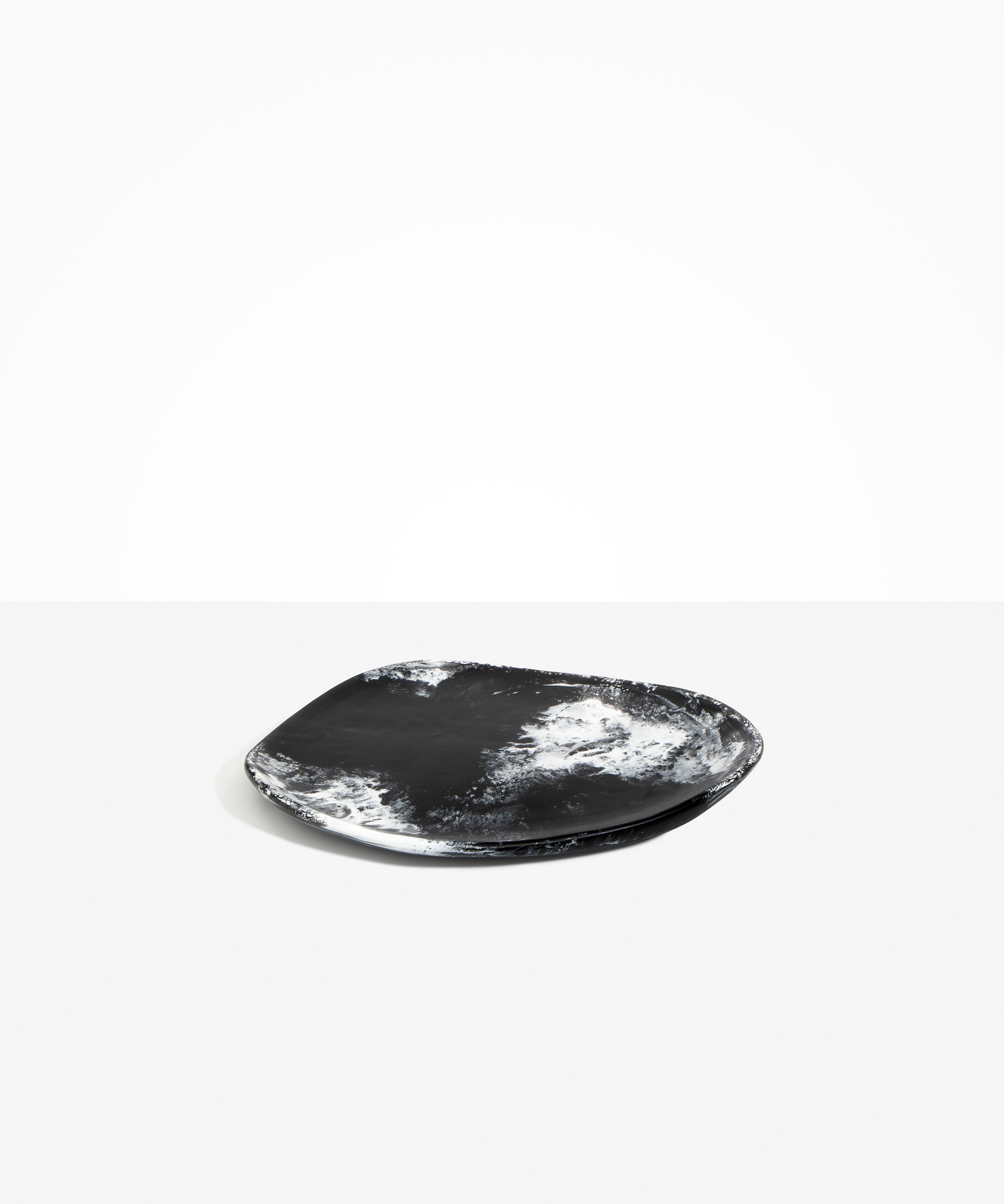 Dinosaur Designs Pebble Plate in Black Marble Colour resin