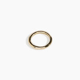 Dinosaur Designs Wishbone Bangle in Nano-Coated Brass Material..