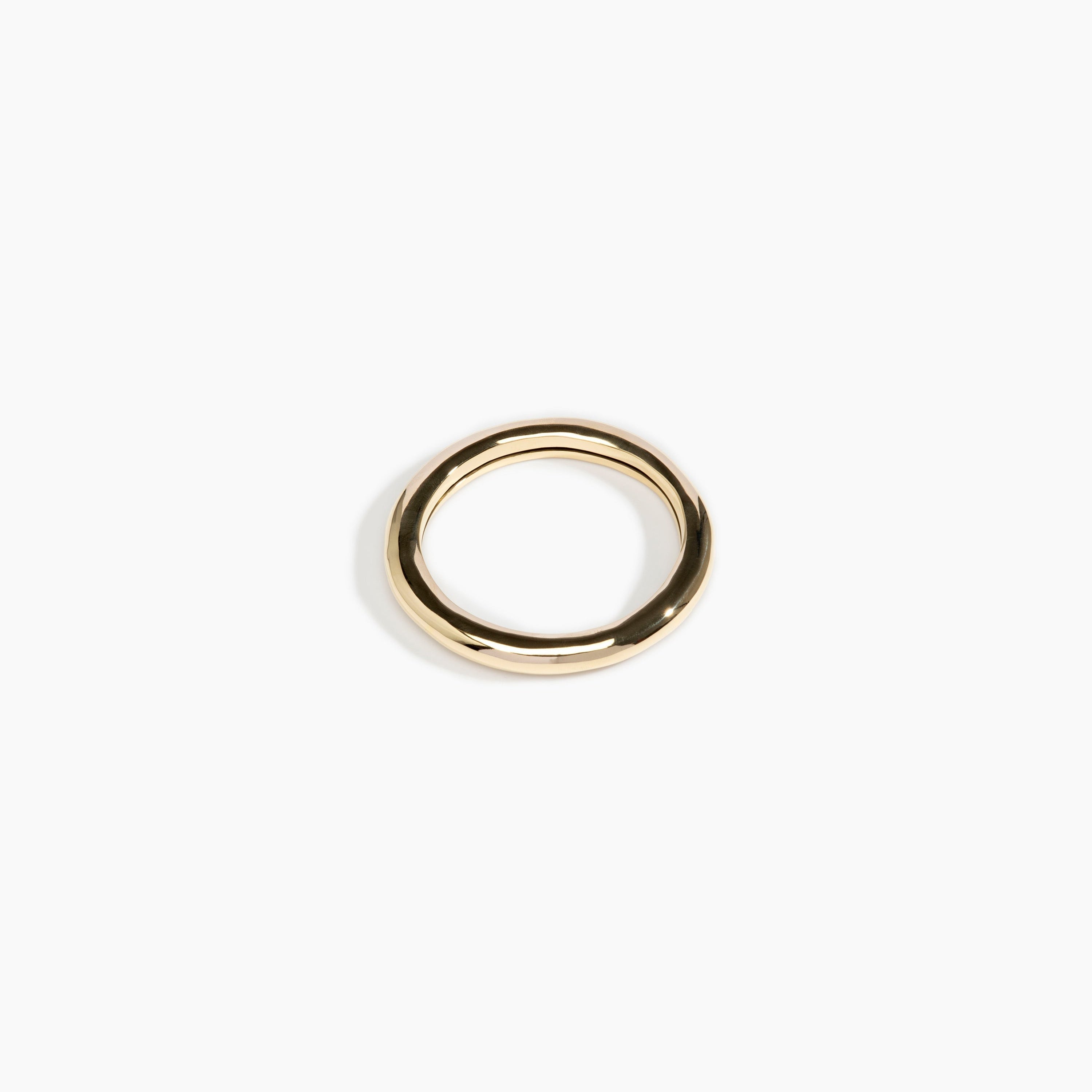 Dinosaur Designs Wishbone Bangle in Nano-Coated Brass Material..