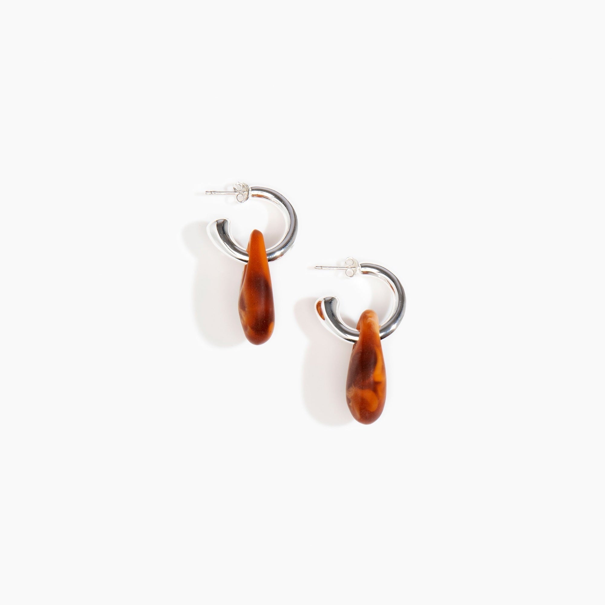 Dinosaur Designs Small Rock Hoop Earrings in Dark Horn Colour resin with Silver-Plated Brass Hoop Material.