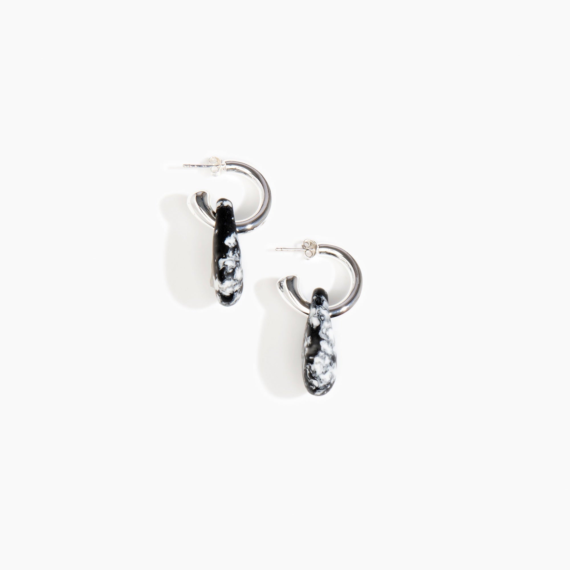 Dinosaur Designs Small Rock Hoop Earrings in Black Marble Colour resin with Silver-Plated Brass Hoop Material.