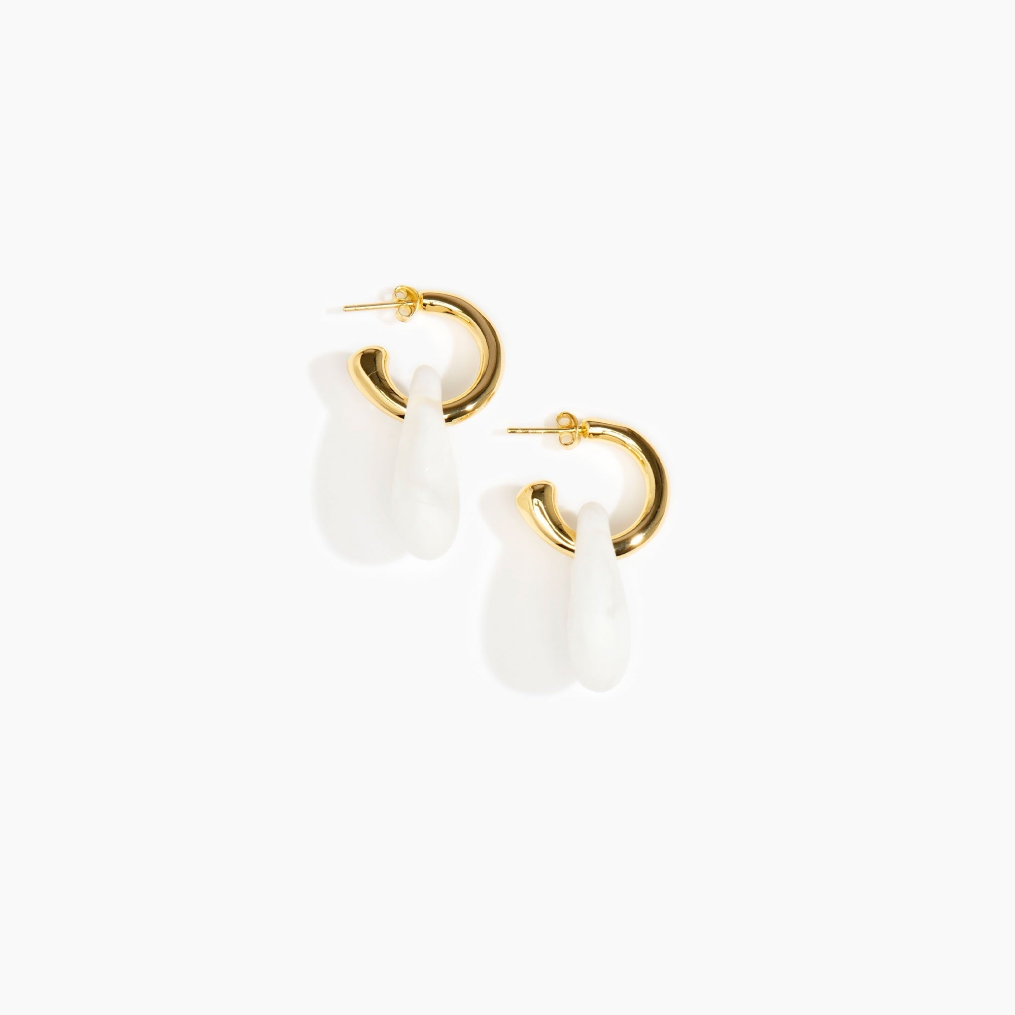 Dinosaur Designs Small Rock Hoop Earrings in Snow Swirl Colour resin with Brass Hoop Material.