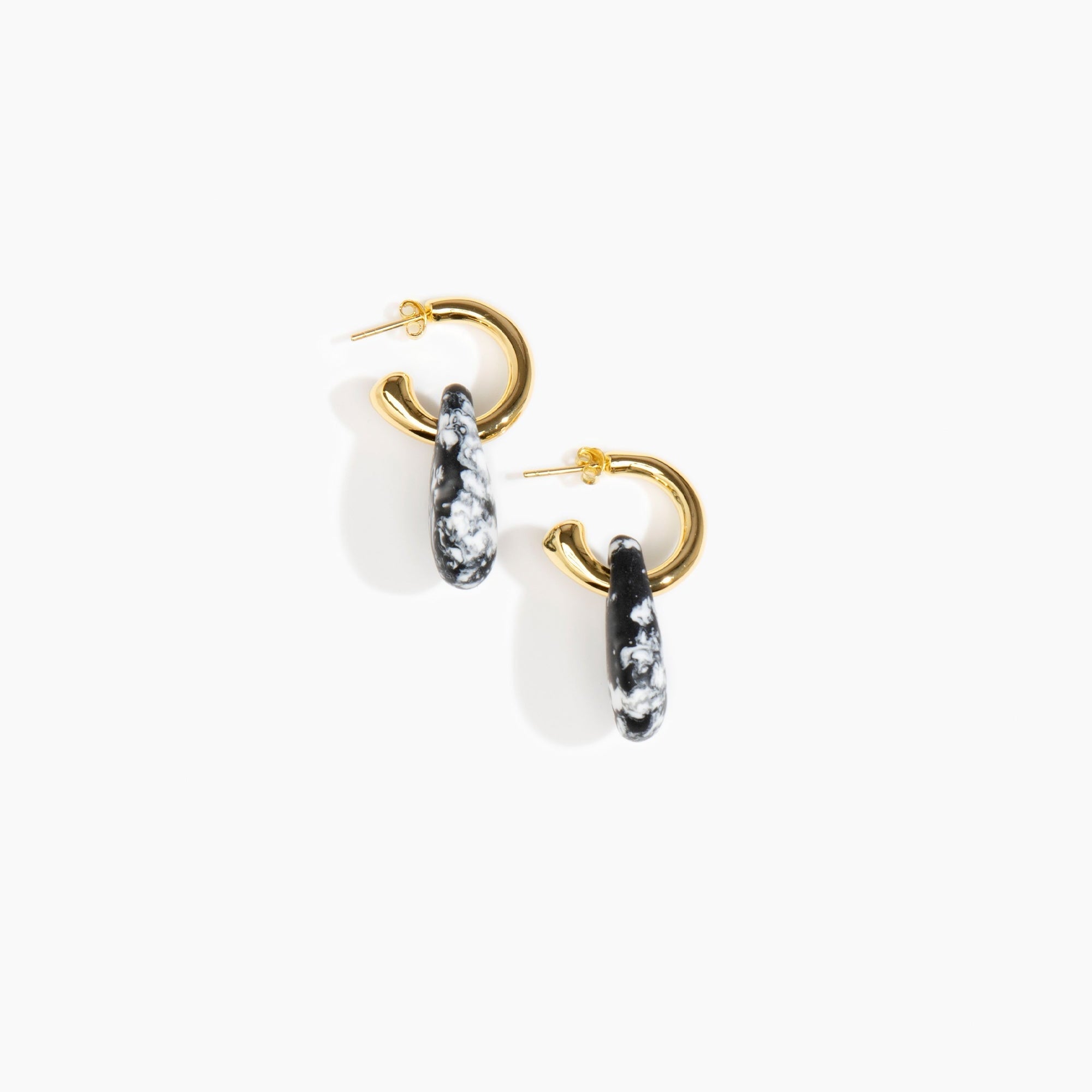 Dinosaur Designs Small Rock Hoop Earrings in Black Marble Colour resin with Brass Hoop Material.