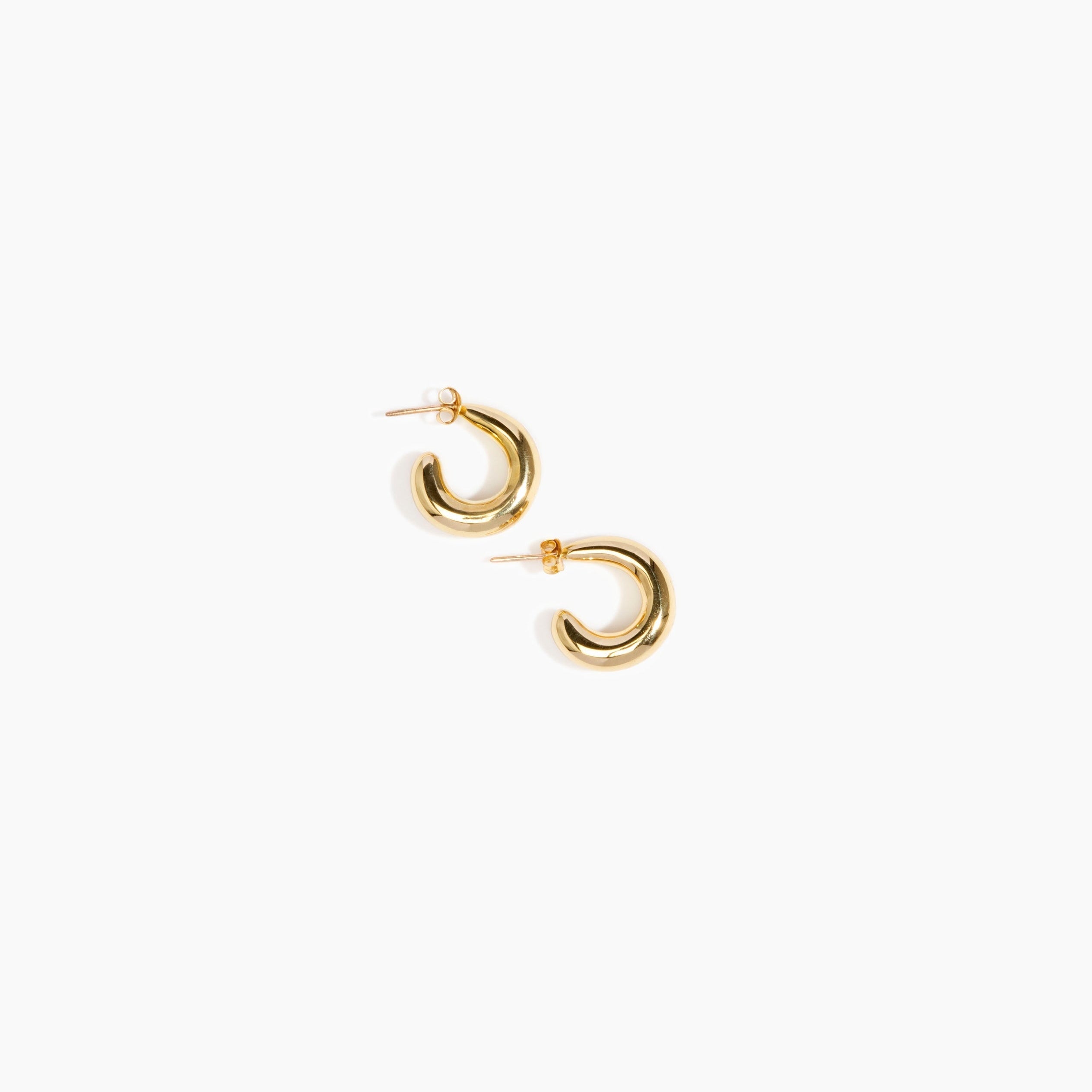 LO Collections Large Liquid Loop Earrings in Nano-Coated Brass Material..