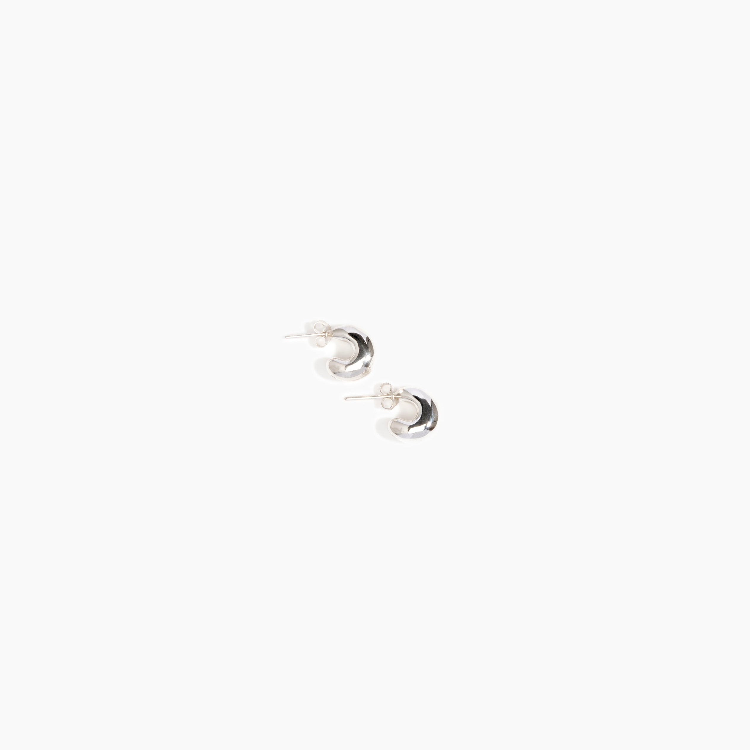 LO Collections Small Liquid Loop Earrings in Silver-Plated Brass Material..