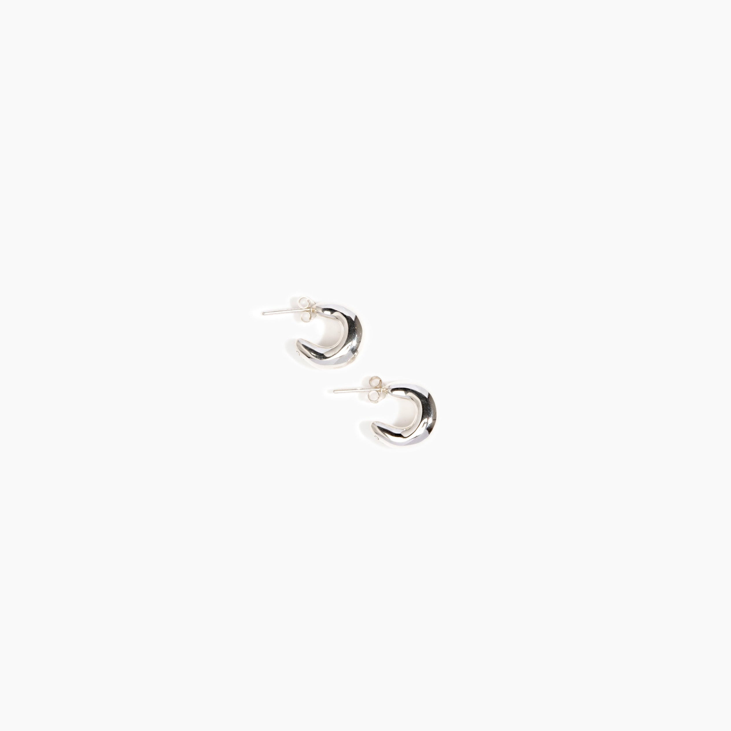 LO Collections Medium Liquid Loop Earrings in Silver-Plated Brass Material..