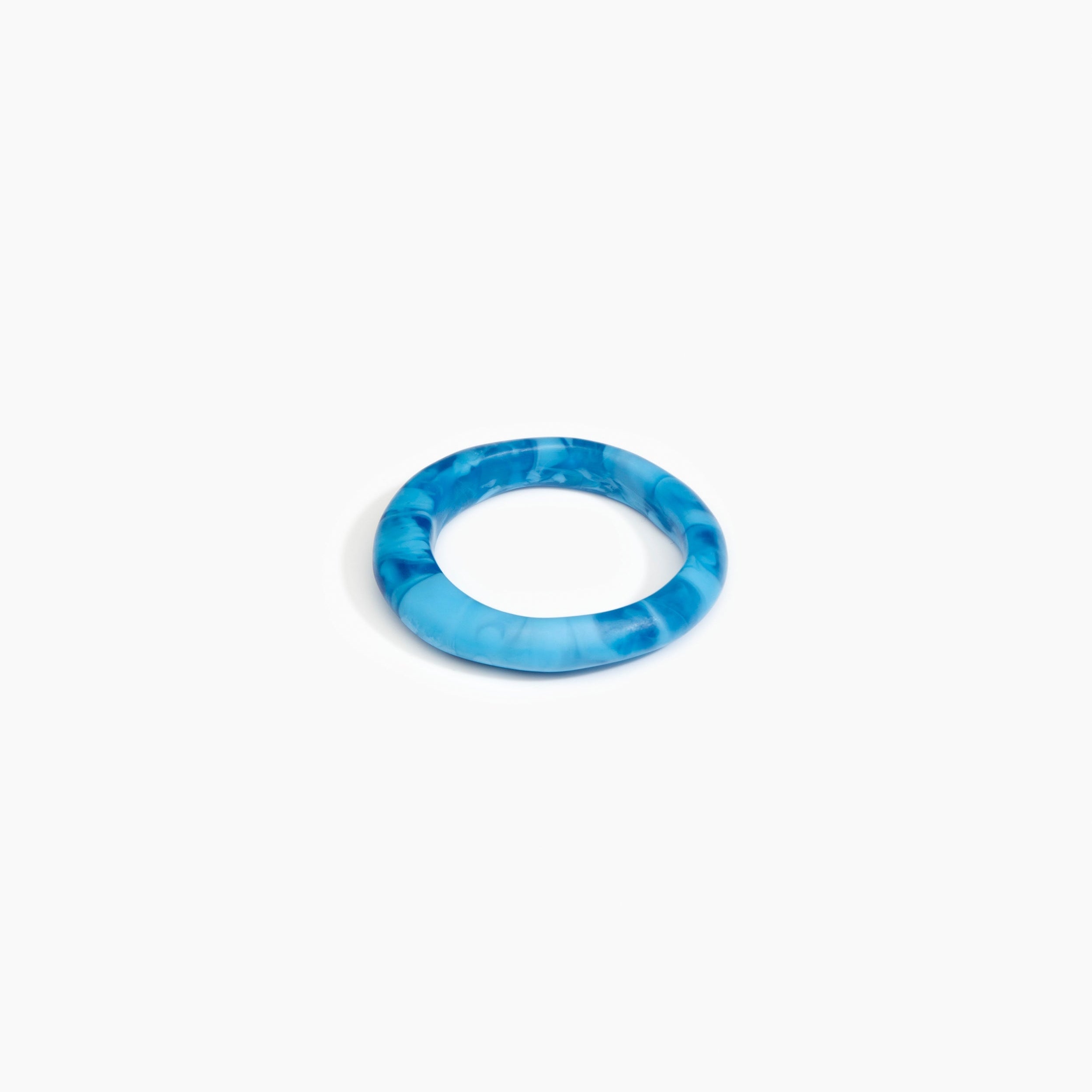 Dinosaur Designs Small Organic Bangle in Sky Colour resin with Regular Fit.