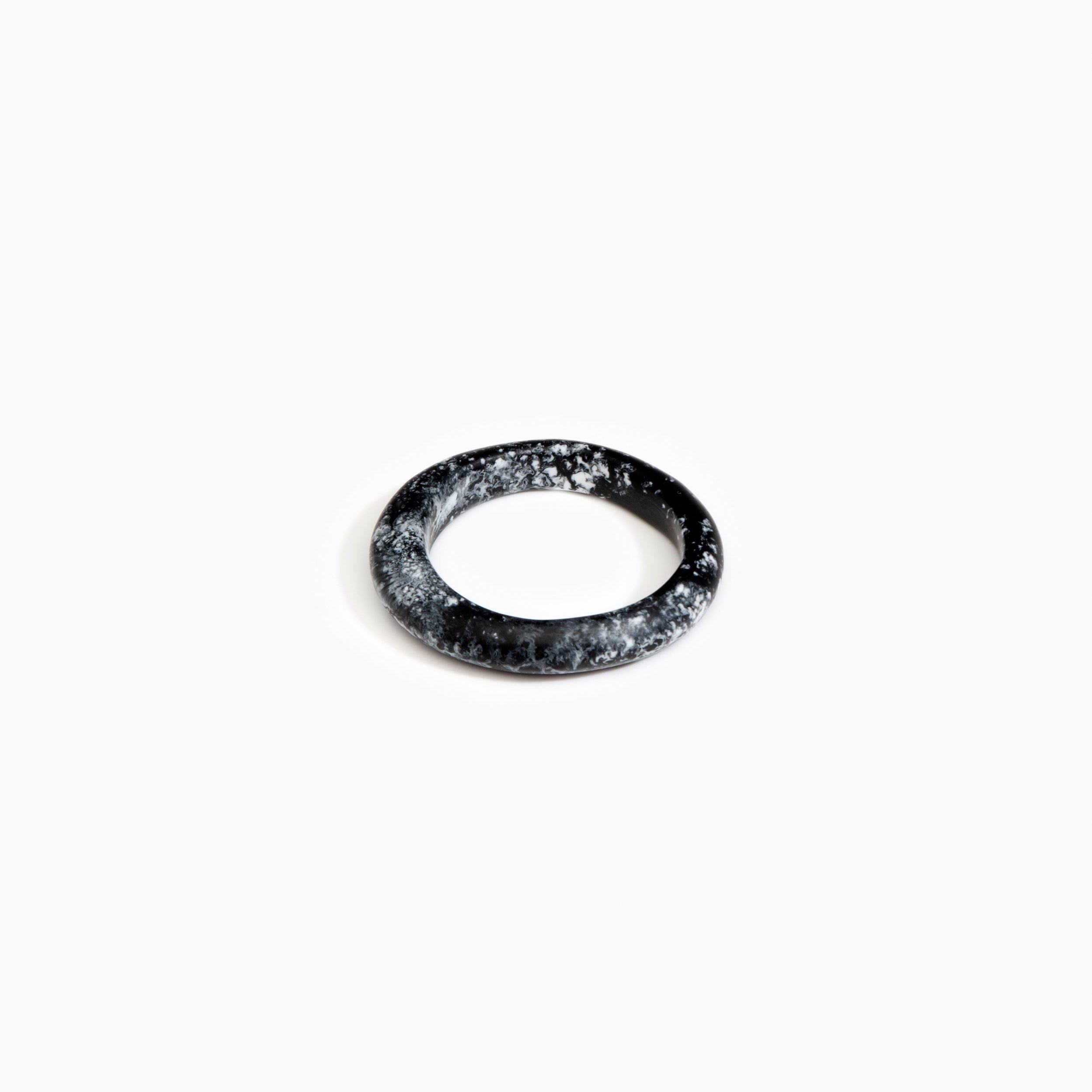 Dinosaur Designs Small Organic Bangle in Black Marble Colour resin with Regular Fit.