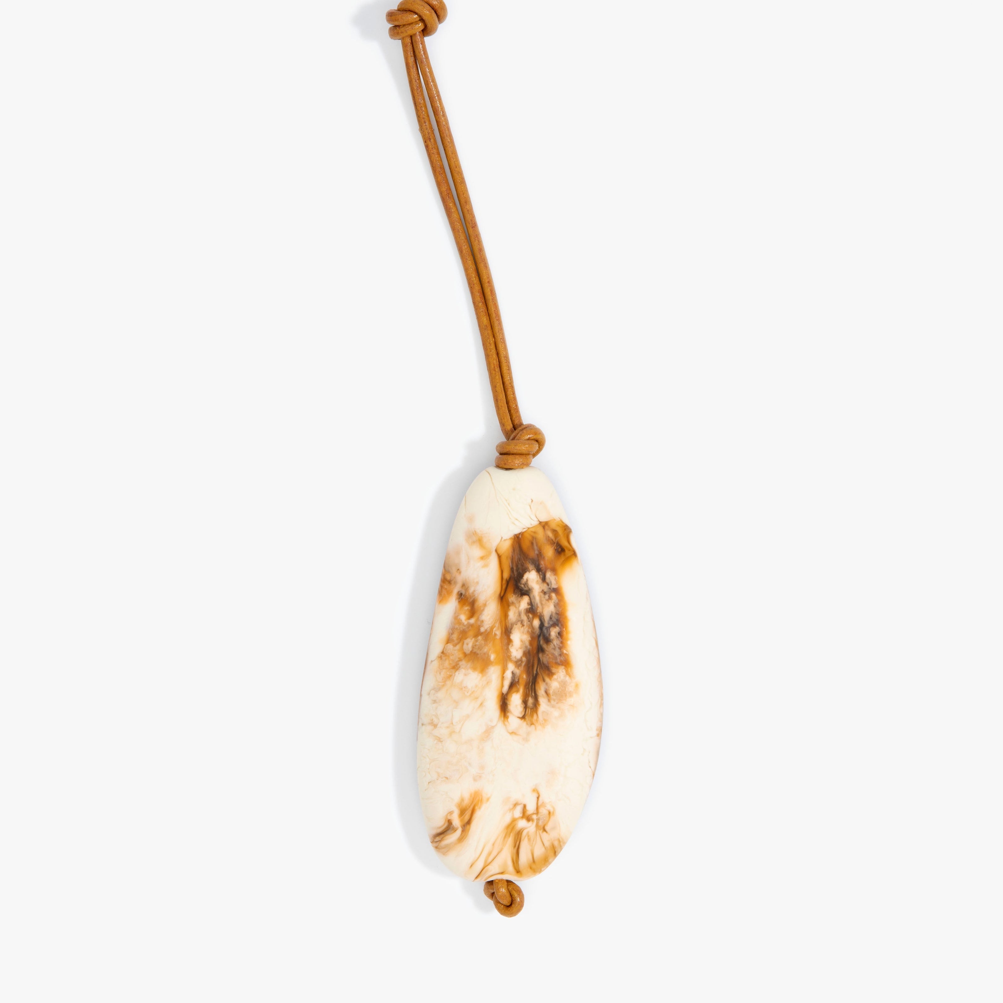 Dinosaur Designs Pebble Keyring in Light Horn Colour resin.