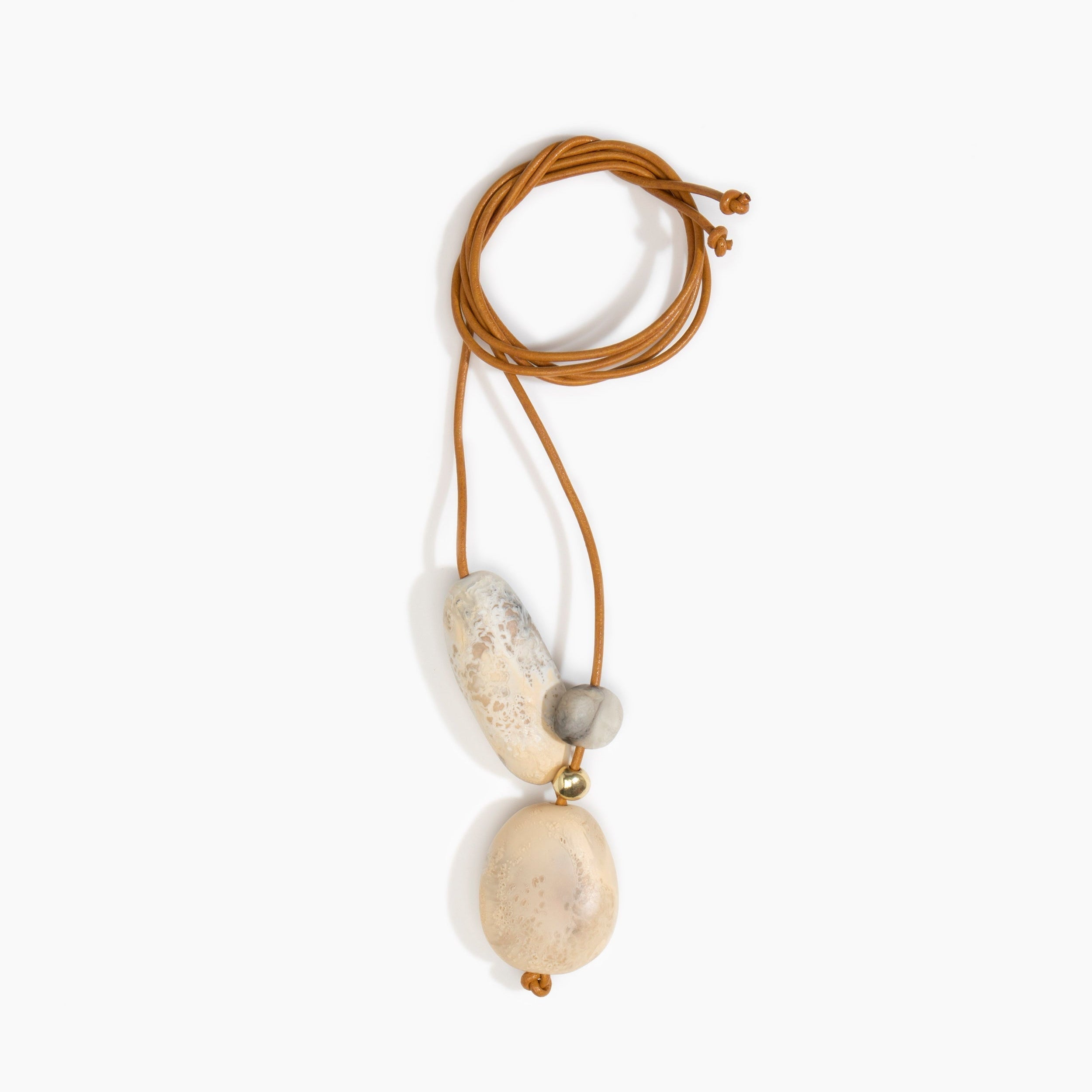 Dinosaur Designs Rock Cluster Pendant in Sandy Pearl Colour resin with Nano-Coated Brass Bead Material.
