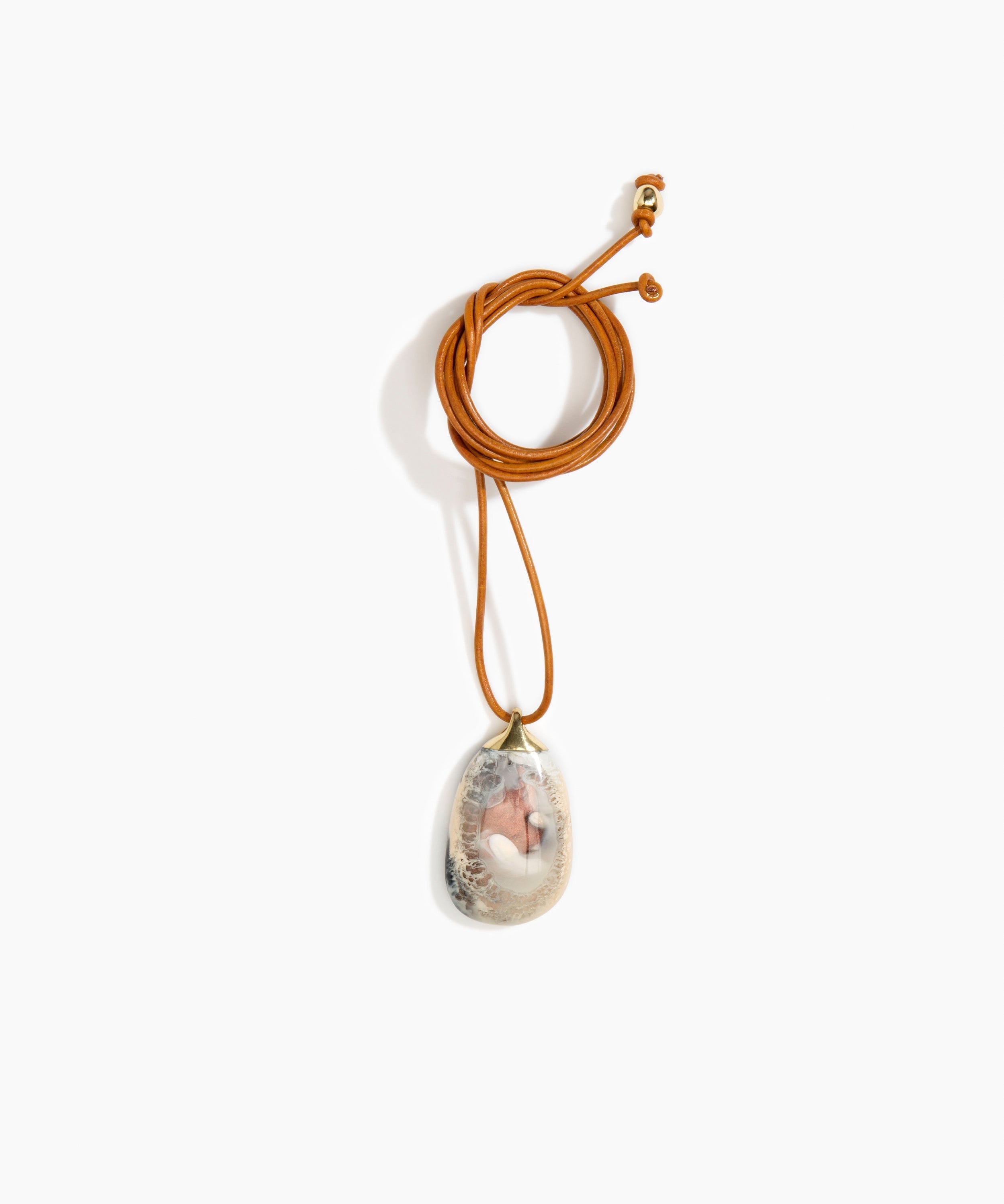 Dinosaur Designs River Rock Pendant on Leather in Sandy Pearl Colour resin