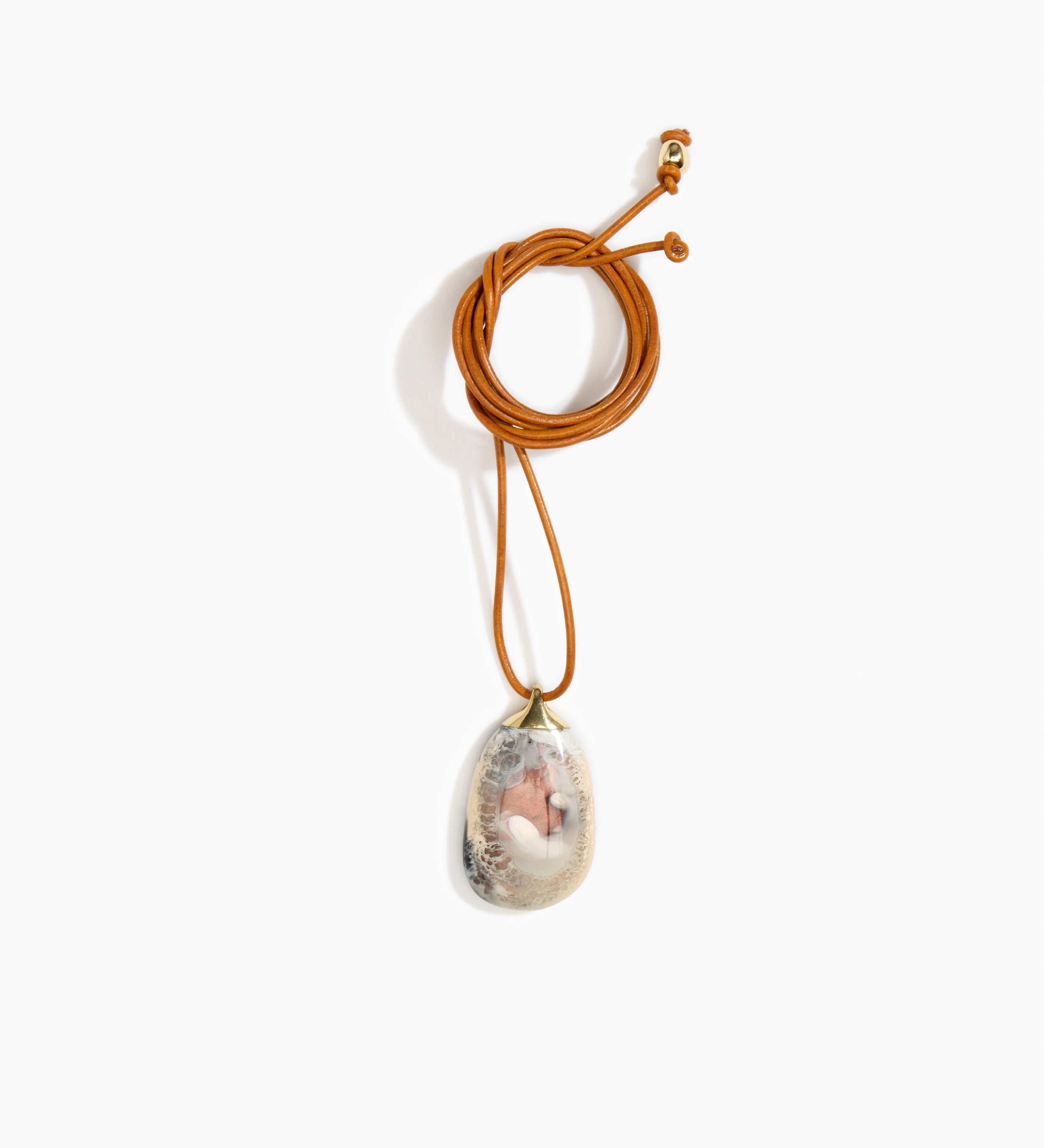 Dinosaur Designs River Rock Pendant on Leather Necklaces in Sandy Pearl Colour resin 