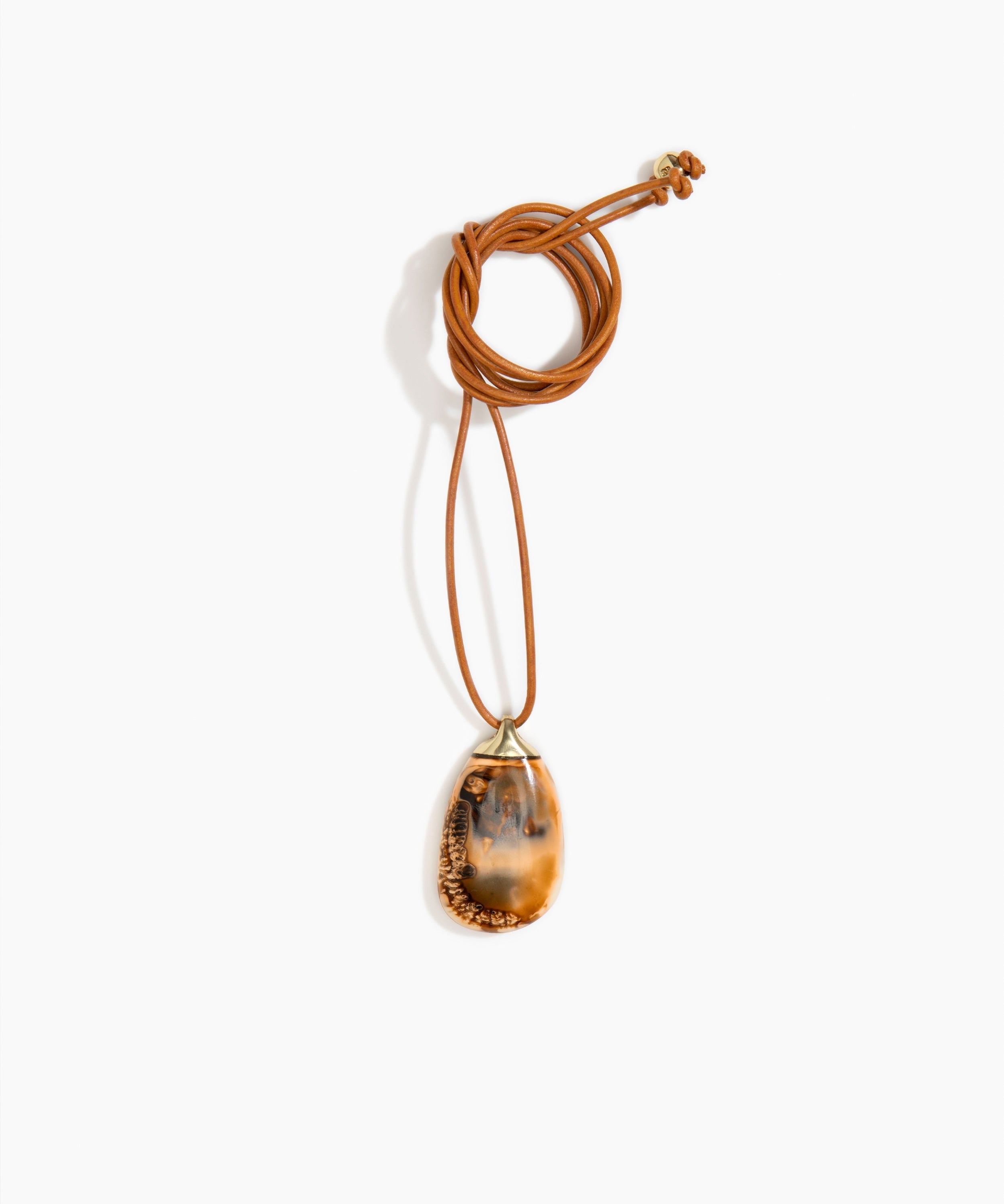 Dinosaur Designs River Rock Pendant on Leather in Dark Horn Colour resin