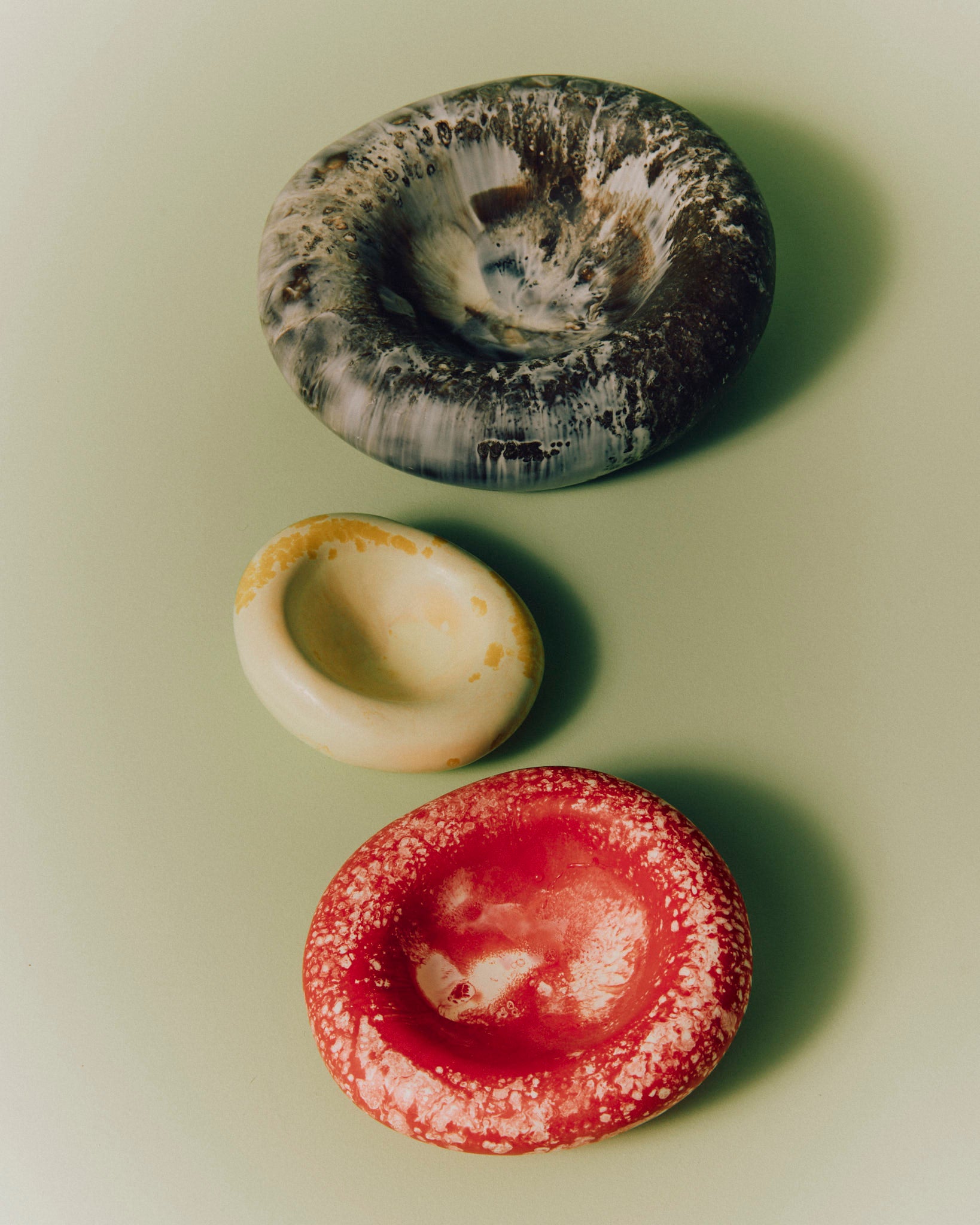 Resin Handmade Drift Dishes in Cappuccino (brown), Daisy (yellow) and Strawberry (red) colourways.