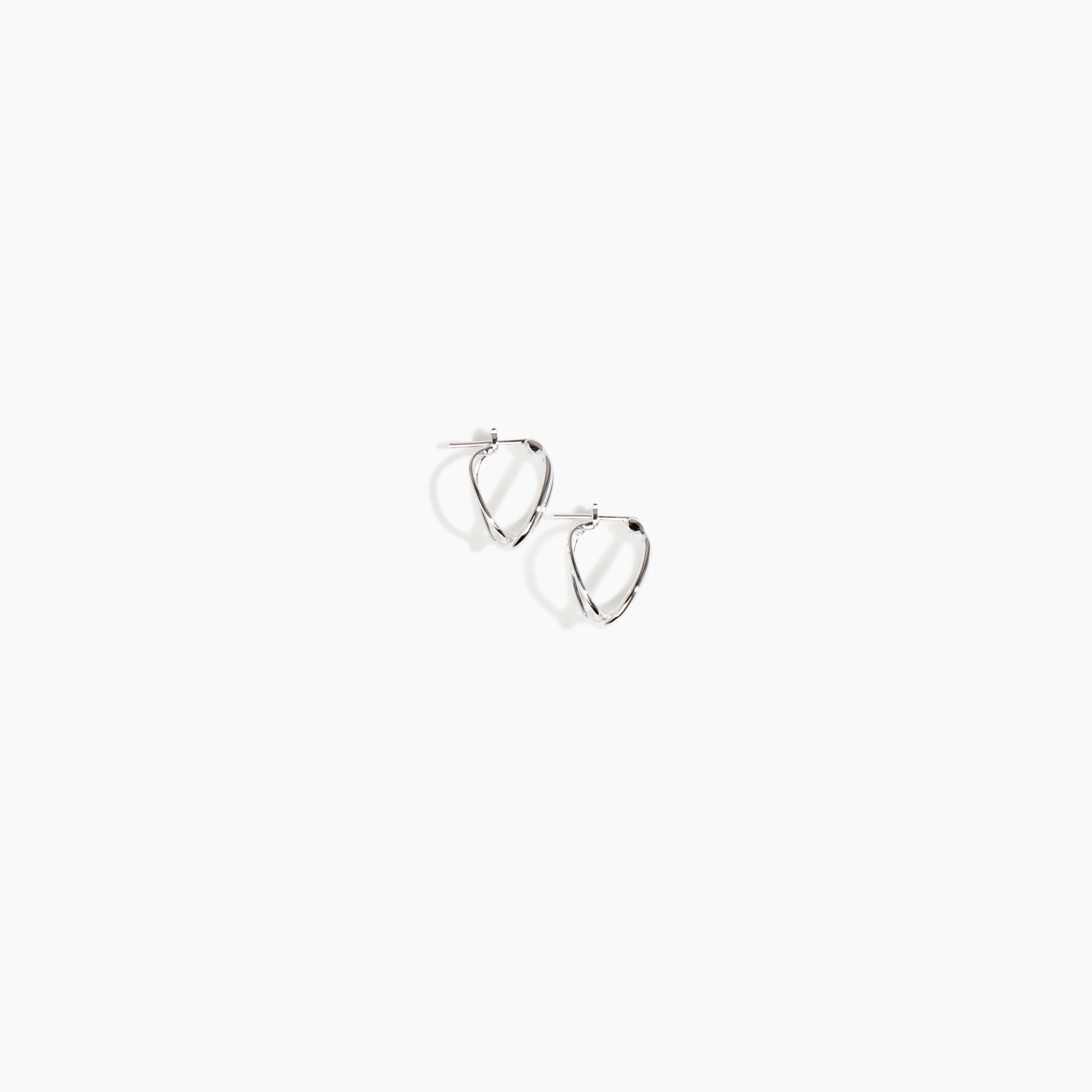 Dinosaur Designs and Alex & Trahanas Small Corda Earrings in Silver — polished silver-toned plated hoop earrings with interlinked twisted loop design.