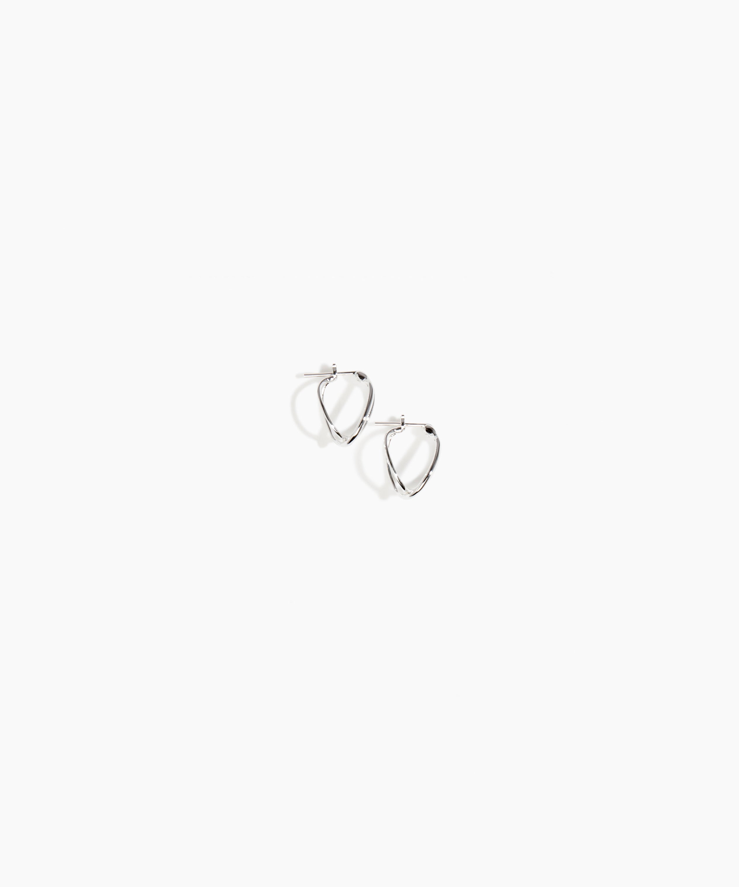 Dinosaur Designs and Alex & Trahanas Small Corda Earrings in Silver — polished silver-toned plated hoop earrings with interlinked twisted loop design