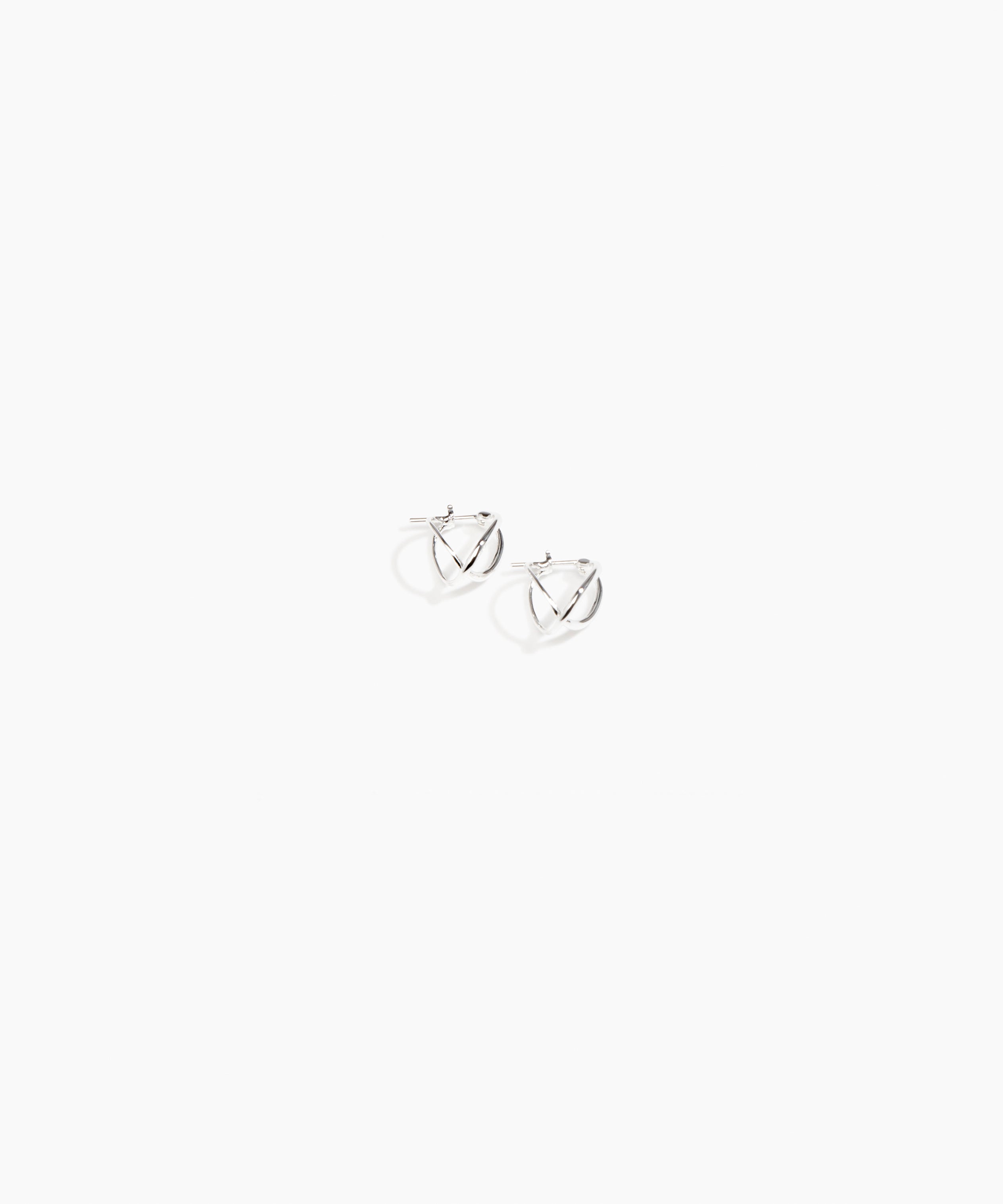 Dinosaur Designs and Alex & Trahanas Small Corda Earrings in Silver — polished silver-toned plated hoop earrings with interlinked twisted loop design.
