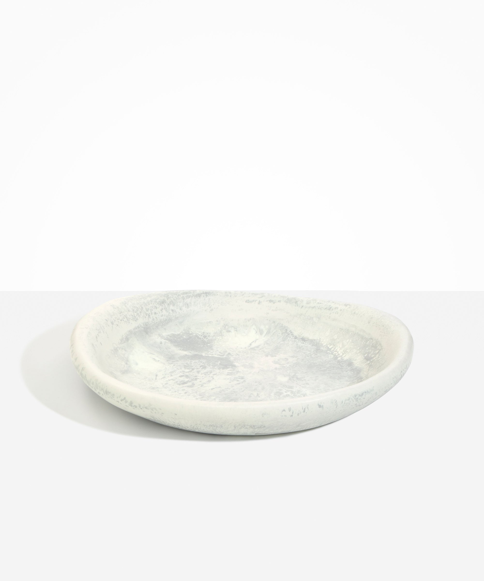 Dinosaur Designs Large Bones Bowl in Cloud — handmade marbled cream and grey resin shallow serving bowl with a rounded organic form