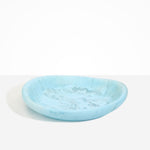 Dinosaur Designs Large Bones Bowl in Pool — handmade marbled blue resin shallow serving bowl with a rounded organic form