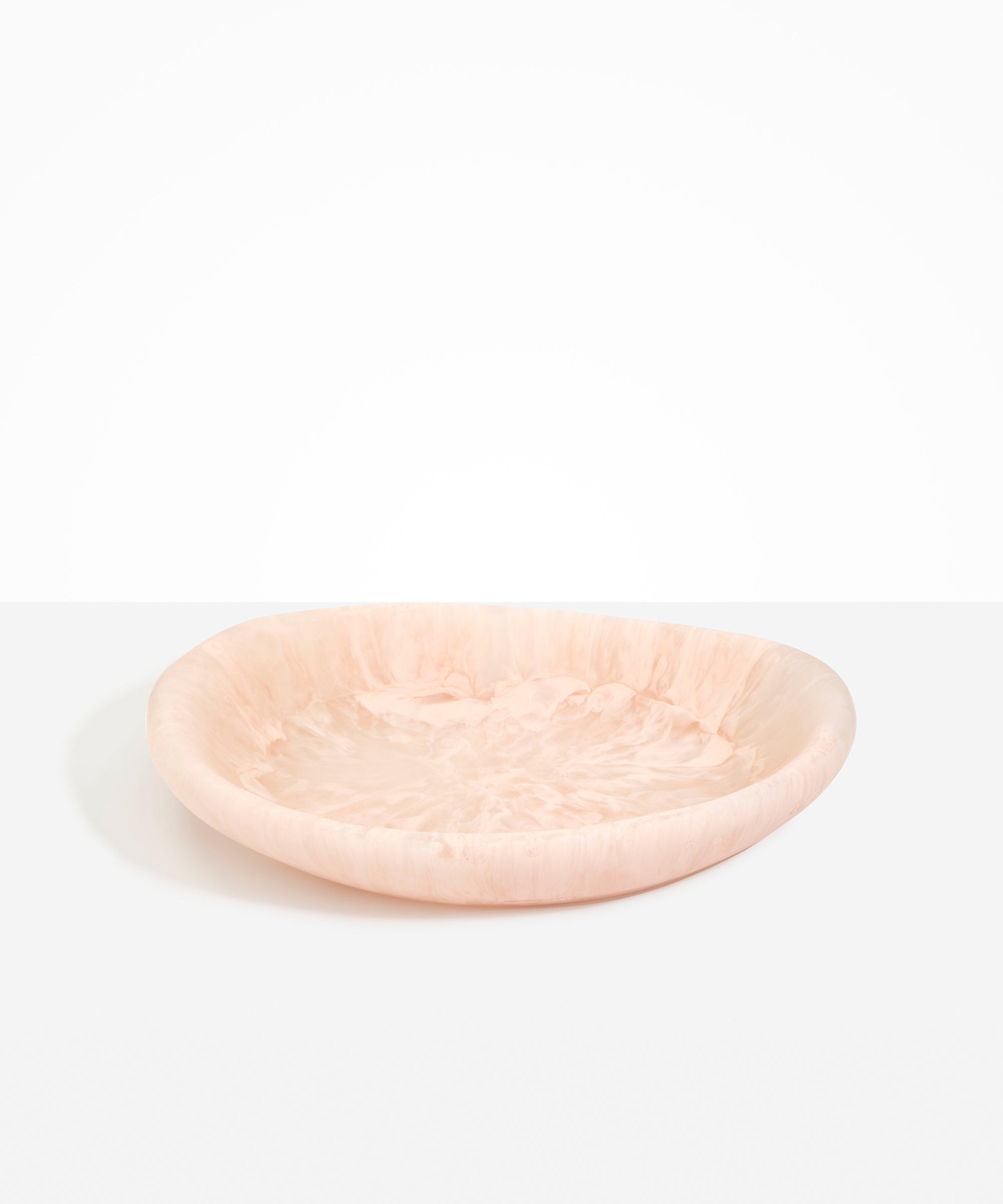 Dinosaur Designs Large Bones Bowl in Rose Swirl — handmade pink resin shallow serving bowl with a rounded organic form...