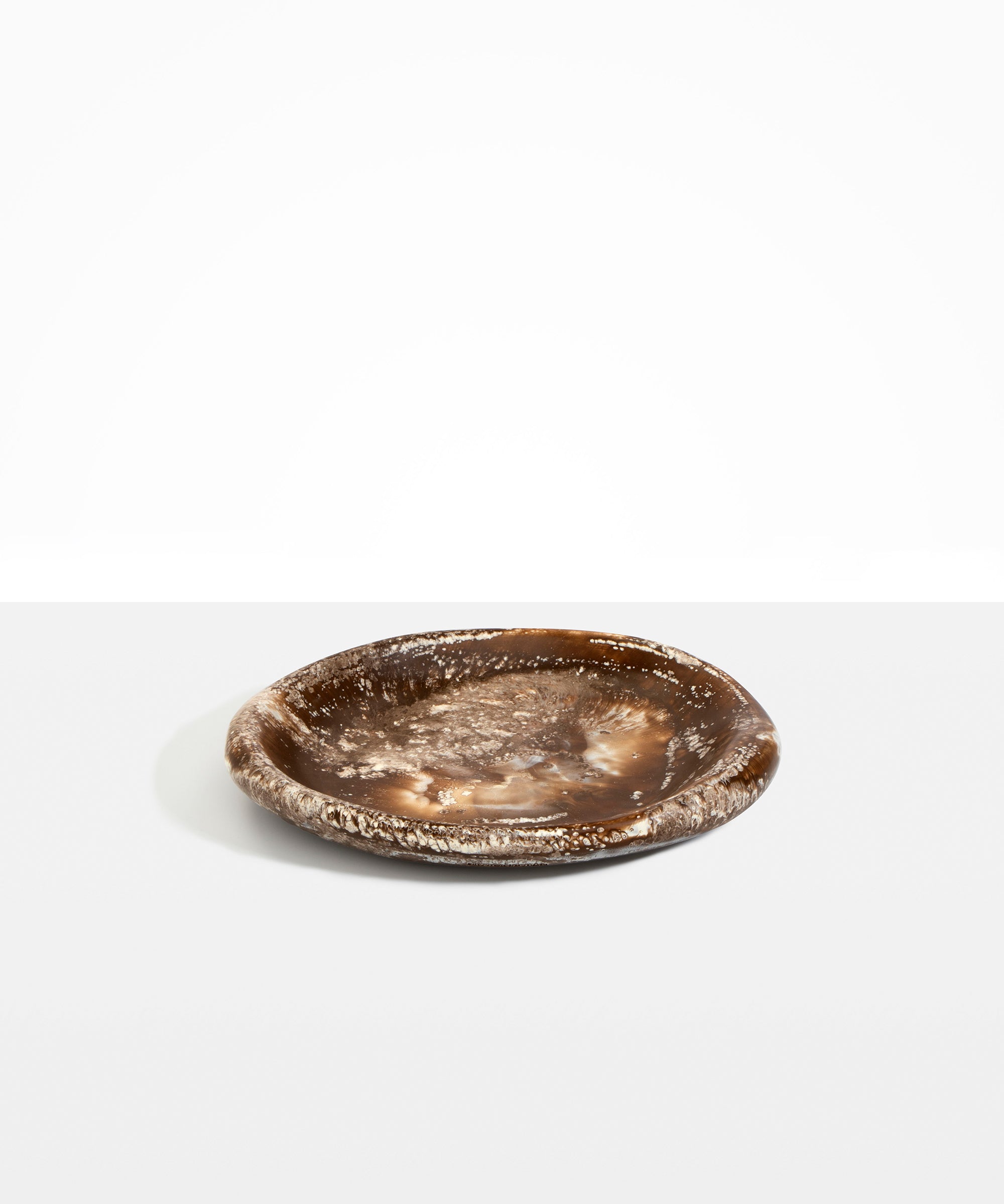 Dinosaur Designs Medium Bones Bowl in Cappuccino — mid sized handmade marbled brown and cream resin shallow serving bowl with a rounded organic form..