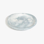 Dinosaur Designs Medium Bones Bowl in Cloud — mid sized handmade marbled cream and grey resin shallow serving bowl with a rounded organic form...