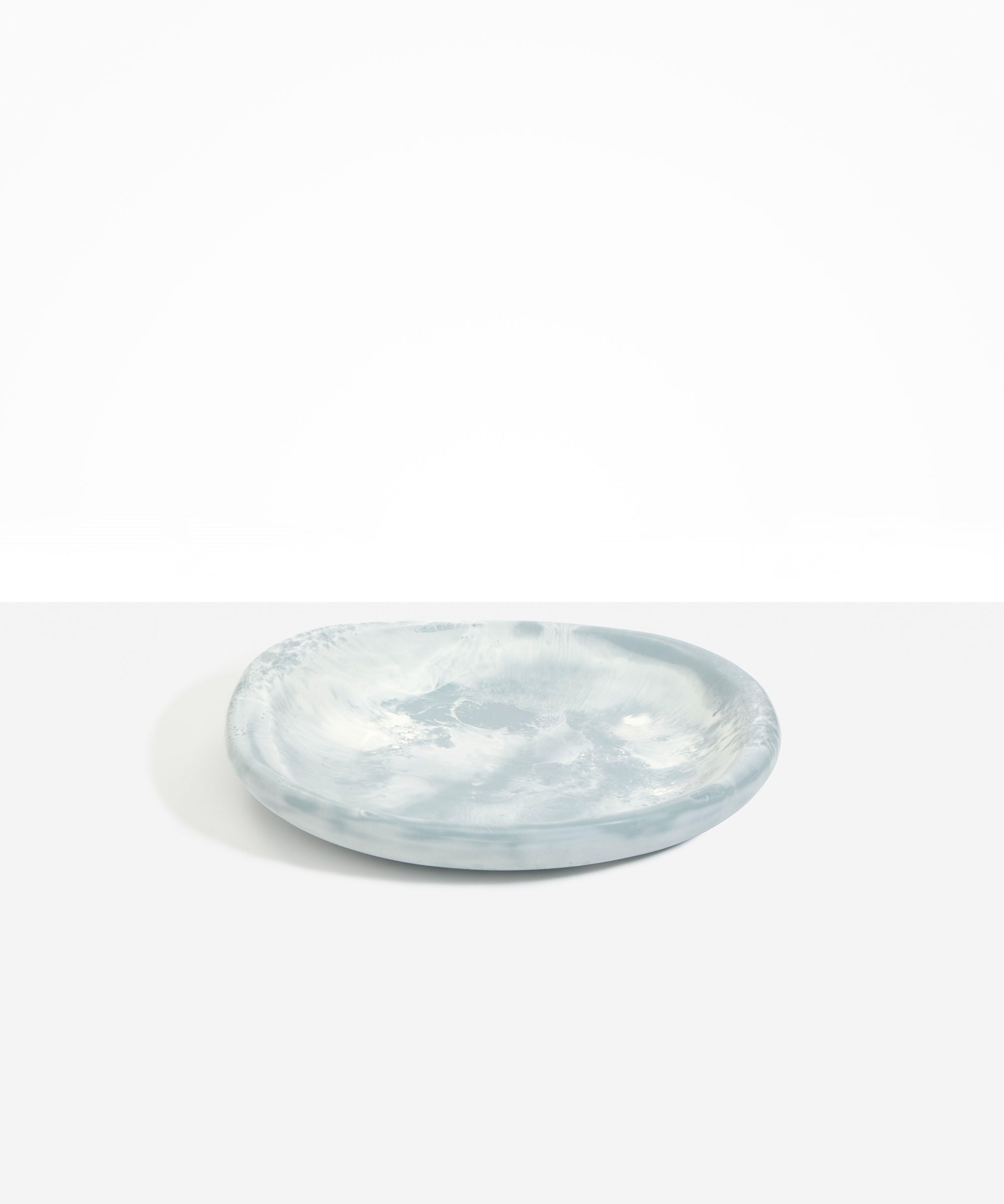 Dinosaur Designs Medium Bones Bowl in Cloud — mid sized handmade marbled cream and grey resin shallow serving bowl with a rounded organic form..