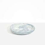 Dinosaur Designs Medium Bones Bowl in Cloud — mid sized handmade marbled cream and grey resin shallow serving bowl with a rounded organic form...