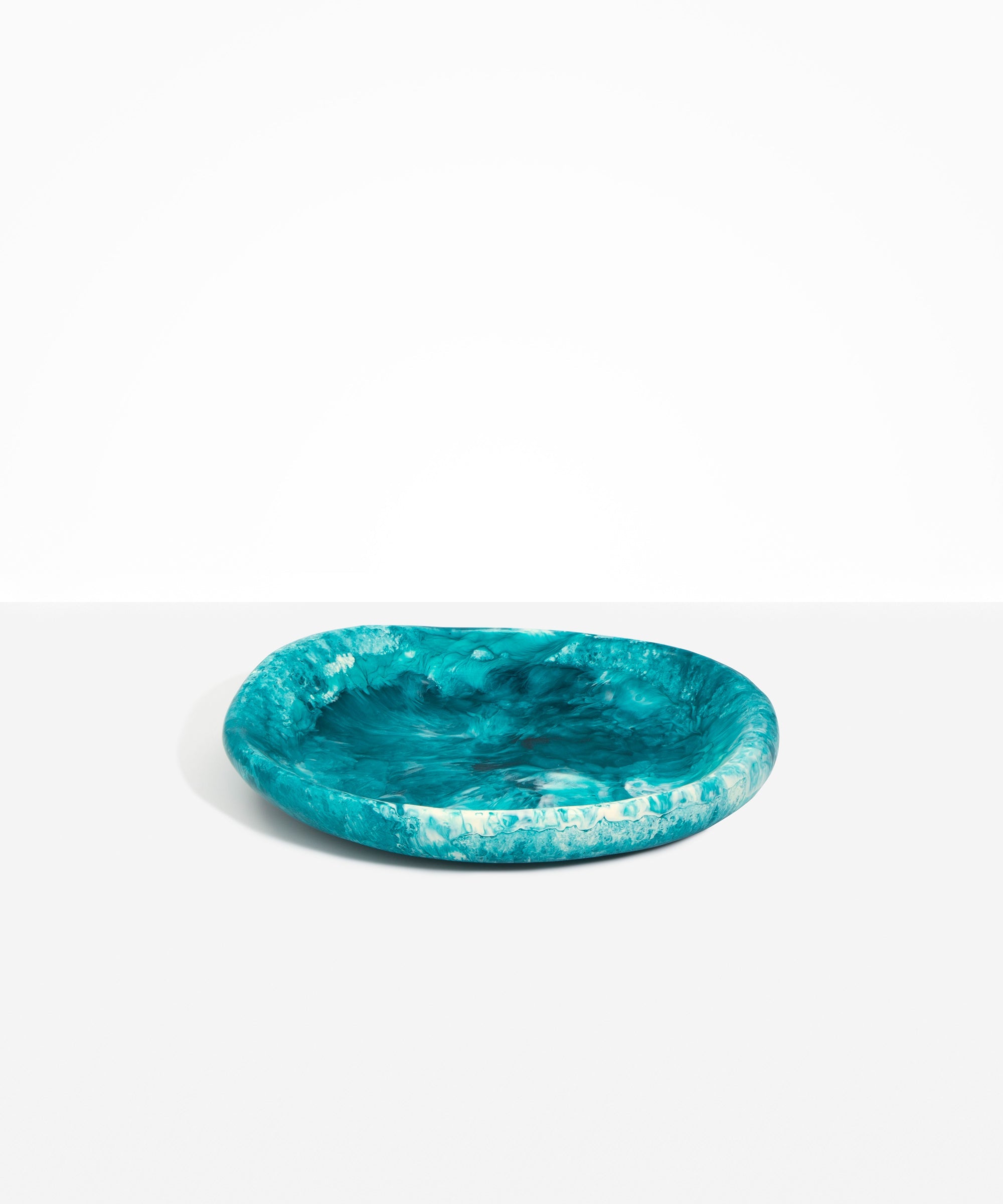 Dinosaur Designs Medium Bones Bowl in Lagoon — mid sized handmade marbled blue and cream resin shallow serving bowl with a rounded organic form