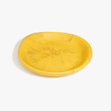 Dinosaur Designs Medium Bones Bowl in Pollen — mid sized handmade marbled yellow resin shallow serving bowl with a rounded organic form...