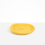 Dinosaur Designs Medium Bones Bowl in Pollen — mid sized handmade marbled yellow resin shallow serving bowl with a rounded organic form...