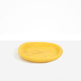 Dinosaur Designs Medium Bones Bowl in Pollen — mid sized handmade marbled yellow resin shallow serving bowl with a rounded organic form...
