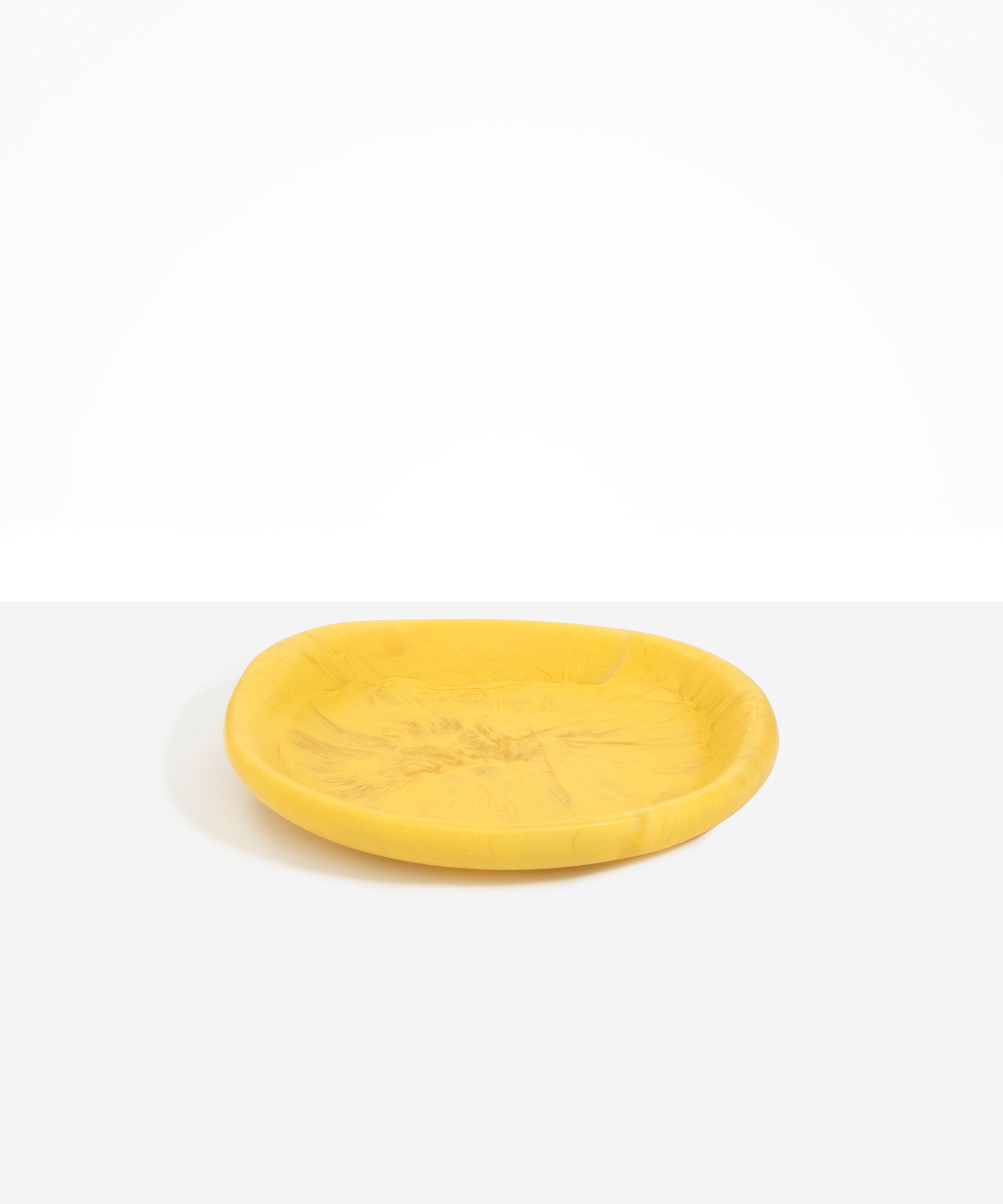 Dinosaur Designs Medium Bones Bowl in Pollen — mid sized handmade marbled yellow resin shallow serving bowl with a rounded organic form...