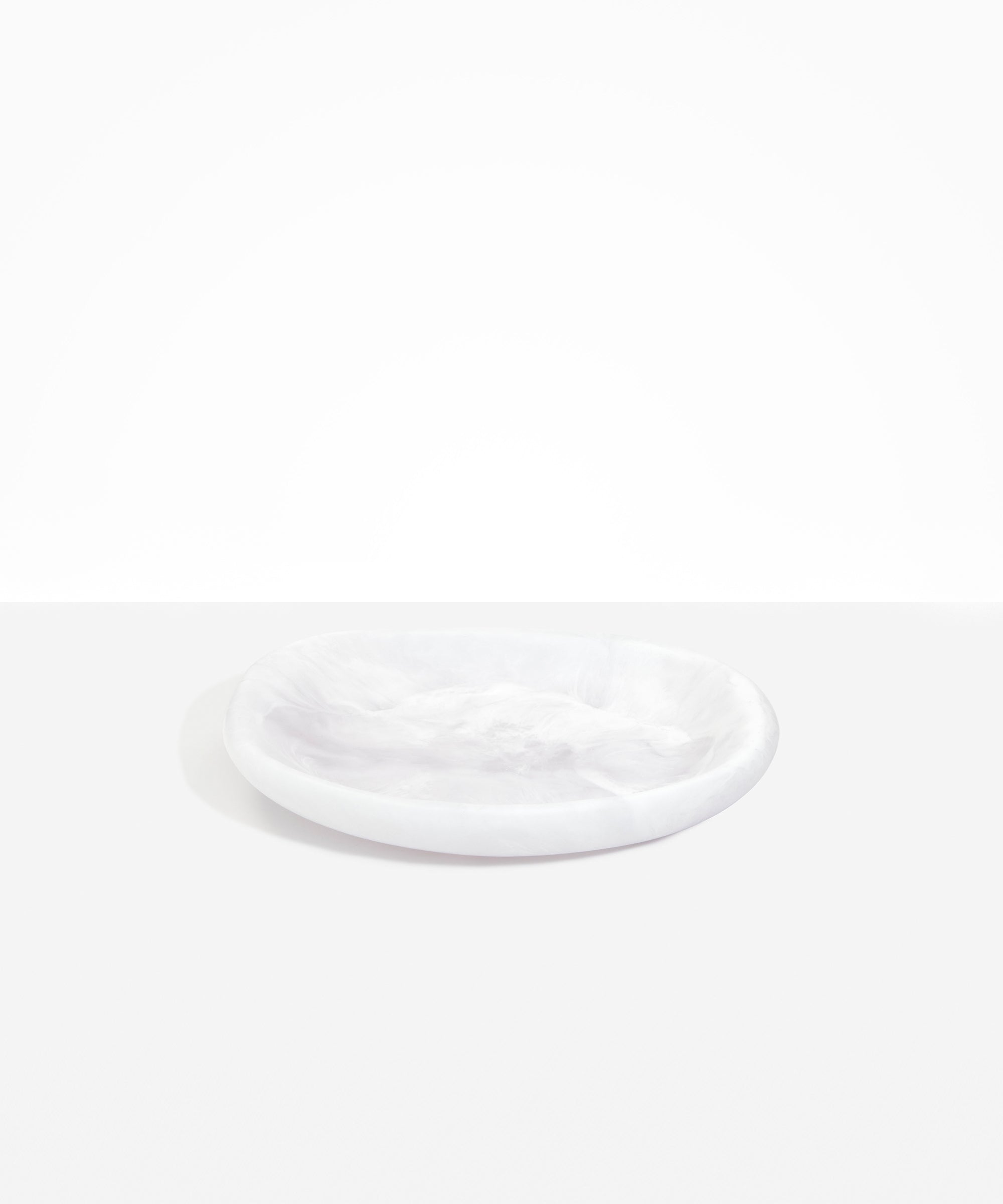 Dinosaur Designs Medium Bones Bowl in Snow Swirl — mid sized handmade marbled white and clear resin shallow serving bowl with a rounded organic form