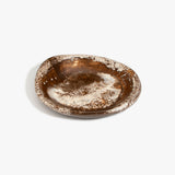 Dinosaur Designs Small Bones Bowl in Cappuccino — small handmade marbled brown and cream resin shallow serving bowl with a rounded organic form..