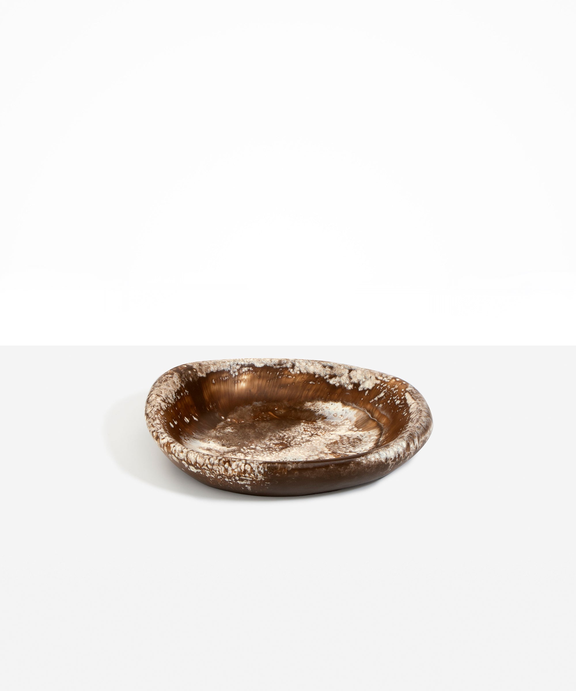 Dinosaur Designs Small Bones Bowl in Cappuccino — small handmade marbled brown and cream resin shallow serving bowl with a rounded organic form..