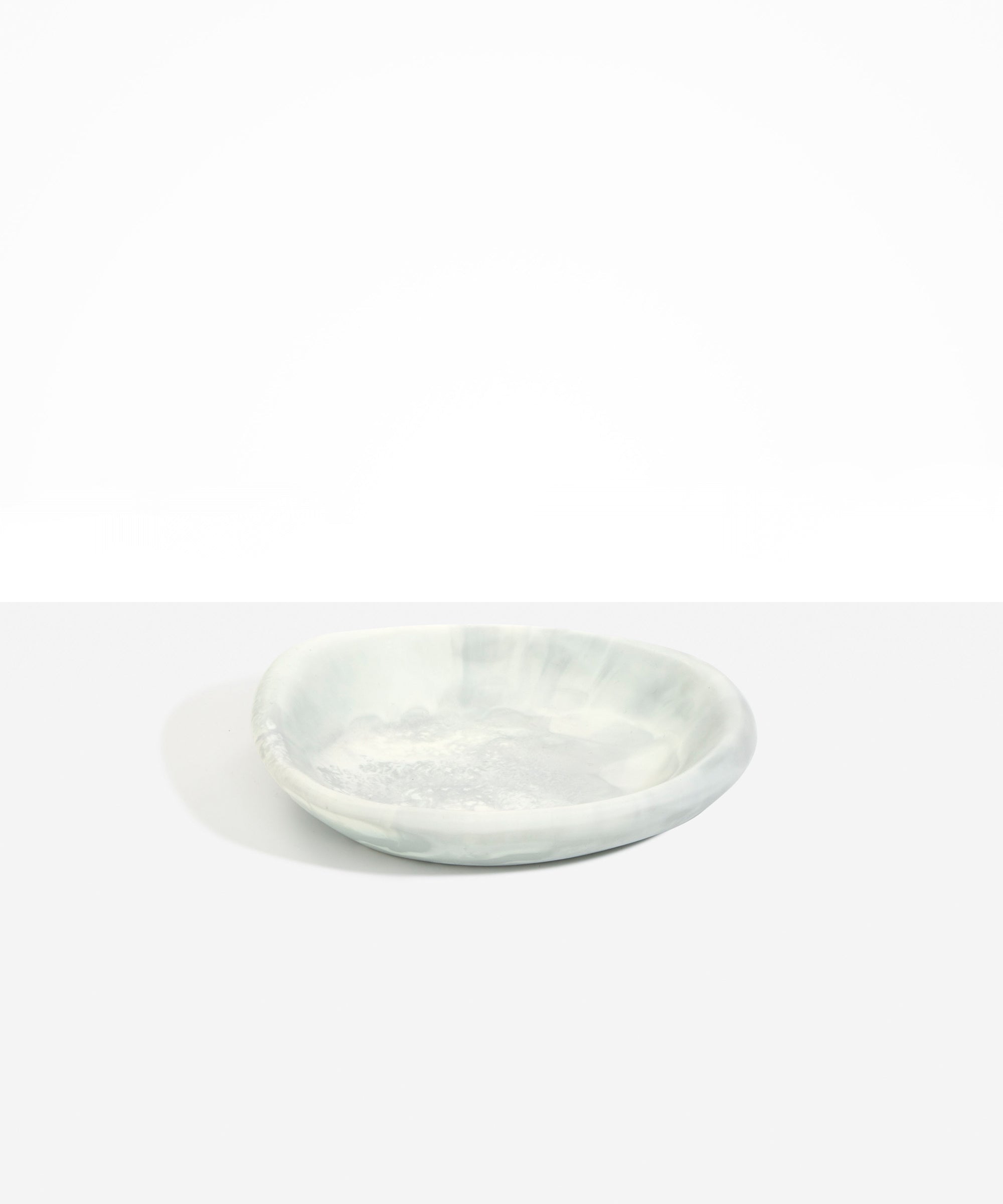 Dinosaur Designs Small Bones Bowl in Cloud — small handmade marbled grey and cream resin shallow serving bowl with a rounded organic form..