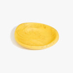 Dinosaur Designs Small Bones Bowl in Pollen — small handmade marbled yellow resin shallow serving bowl with a rounded organic form...