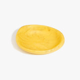 Dinosaur Designs Small Bones Bowl in Pollen — small handmade marbled yellow resin shallow serving bowl with a rounded organic form...