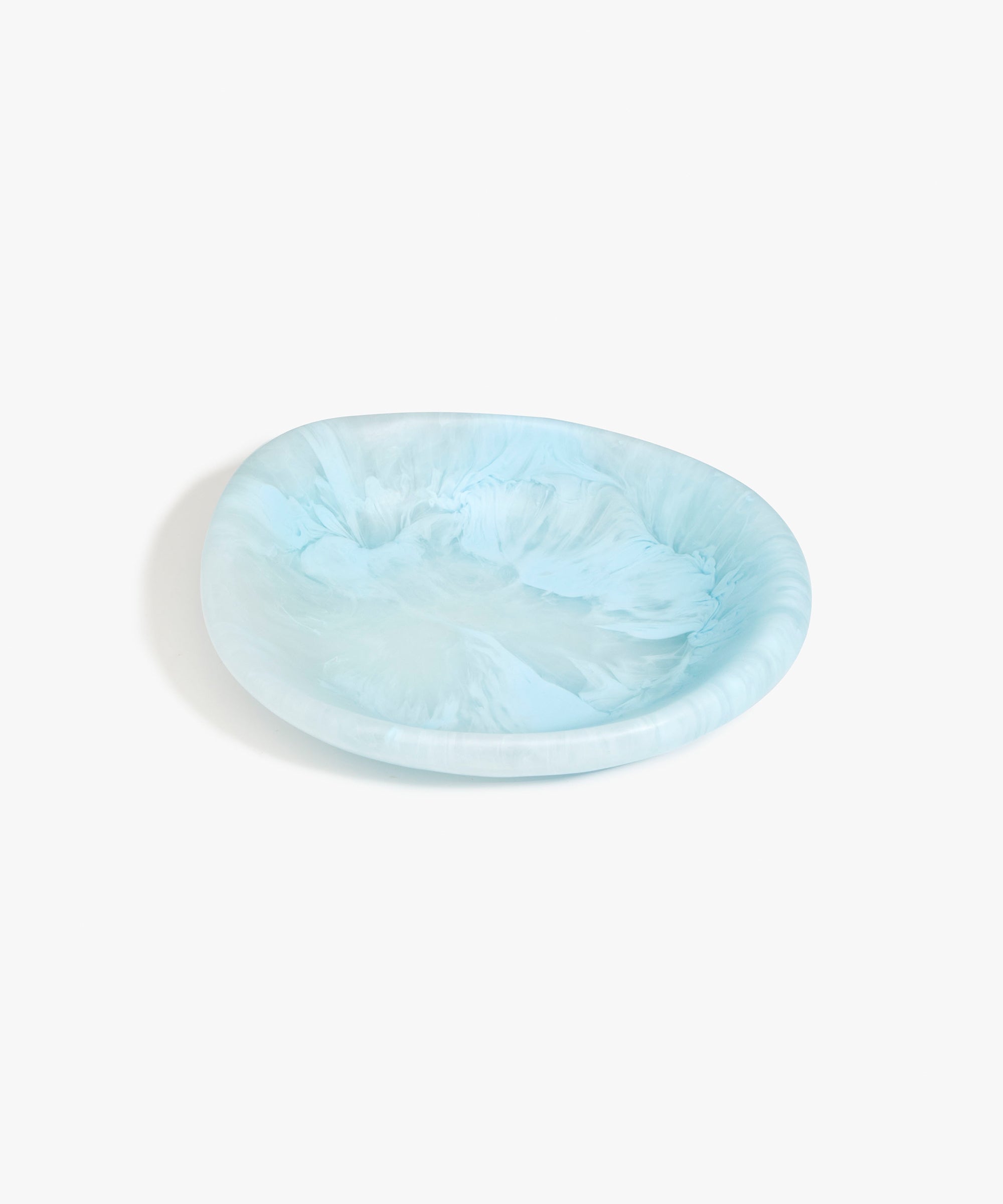 Dinosaur Designs Small Bones Bowl in Pool — small handmade marbled blue resin shallow serving bowl with a rounded organic form..