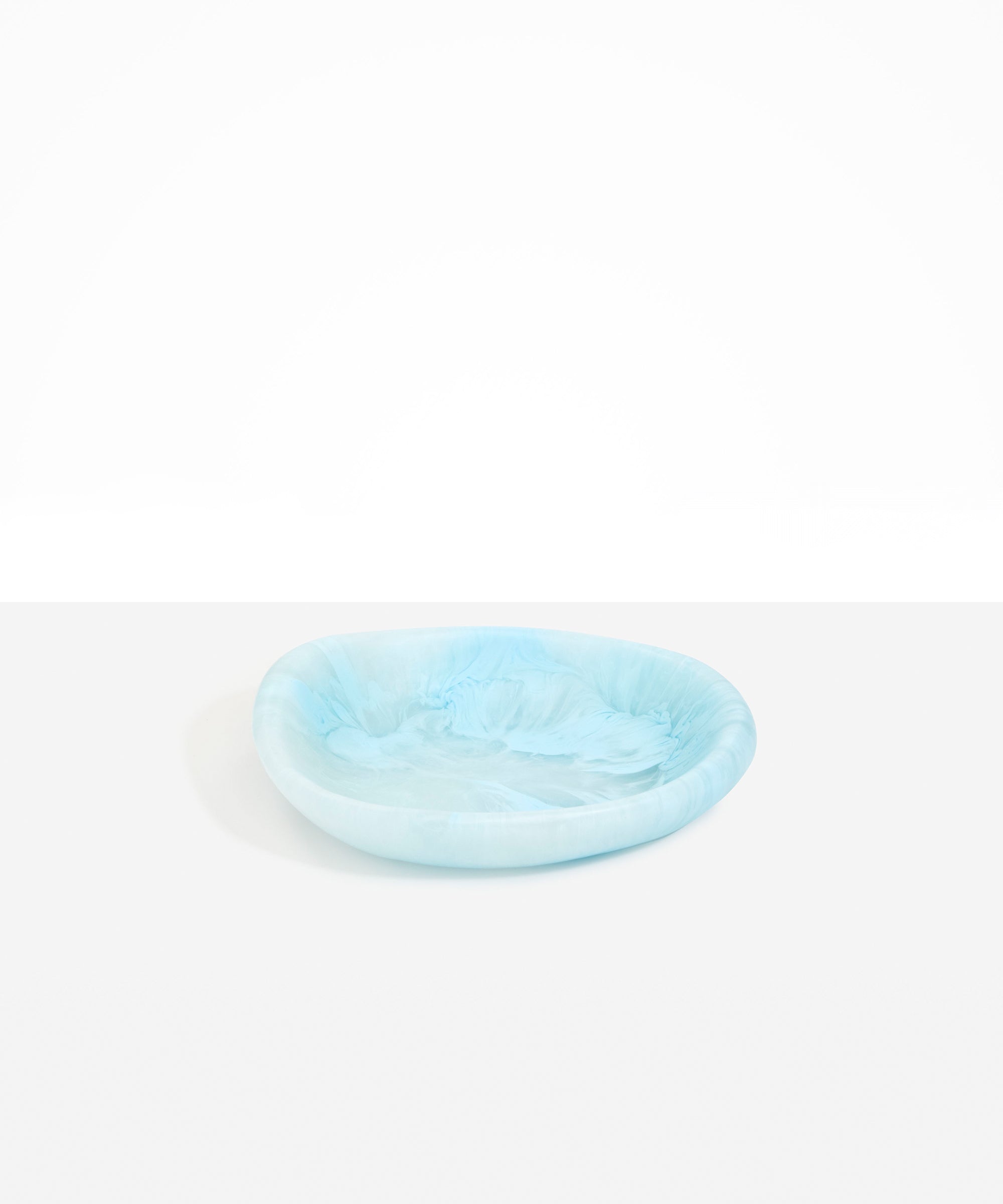 Dinosaur Designs Small Bones Bowl in Pool — small handmade marbled blue resin shallow serving bowl with a rounded organic form...