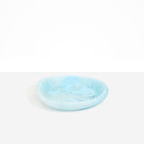 Dinosaur Designs Small Bones Bowl in Pool — small handmade marbled blue resin shallow serving bowl with a rounded organic form..