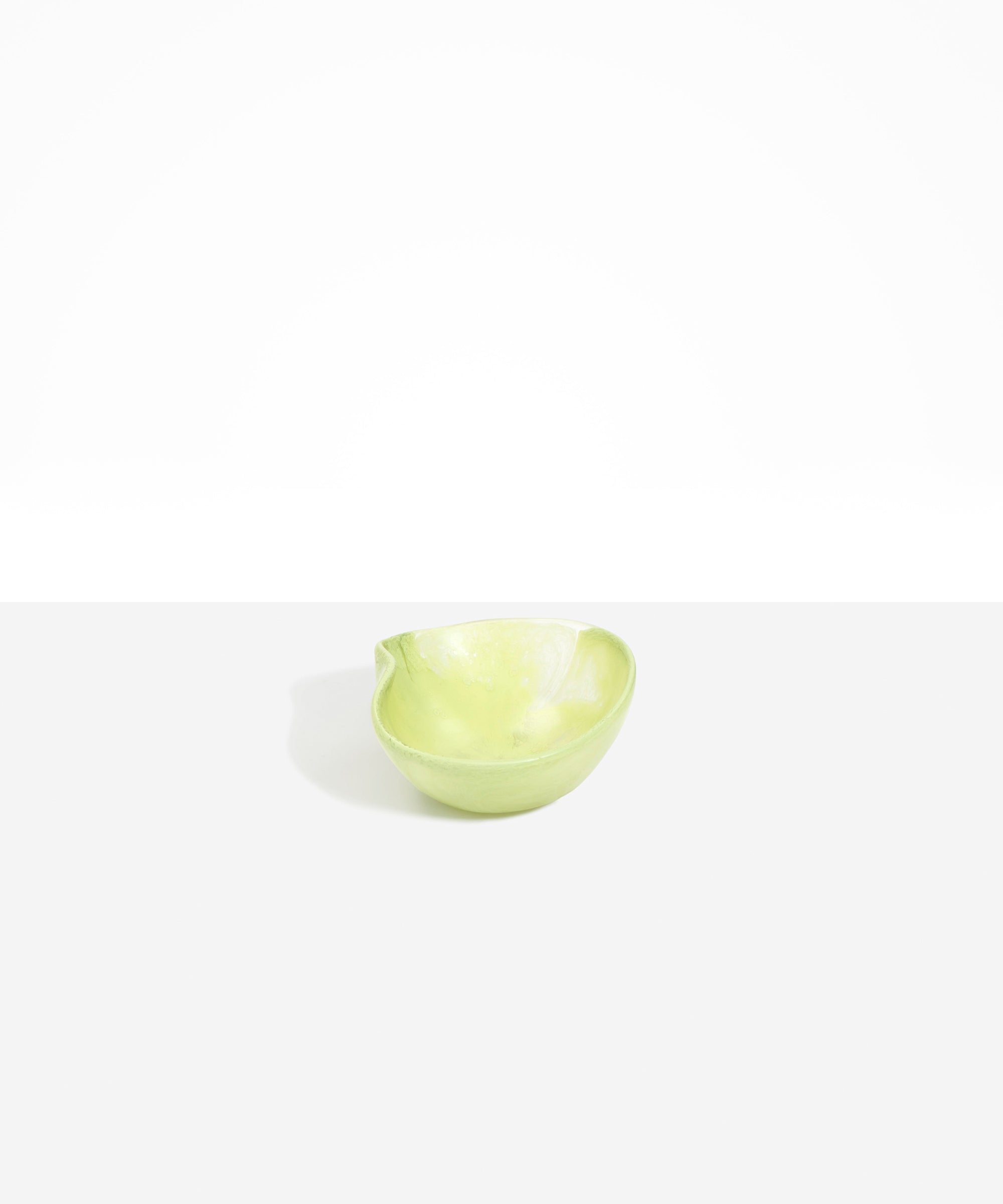 Dinosaur Designs Petal Dessert Bowl in Pistachio — handcrafted marbled pastel green resin bowl with curved form and pinched organic rim
