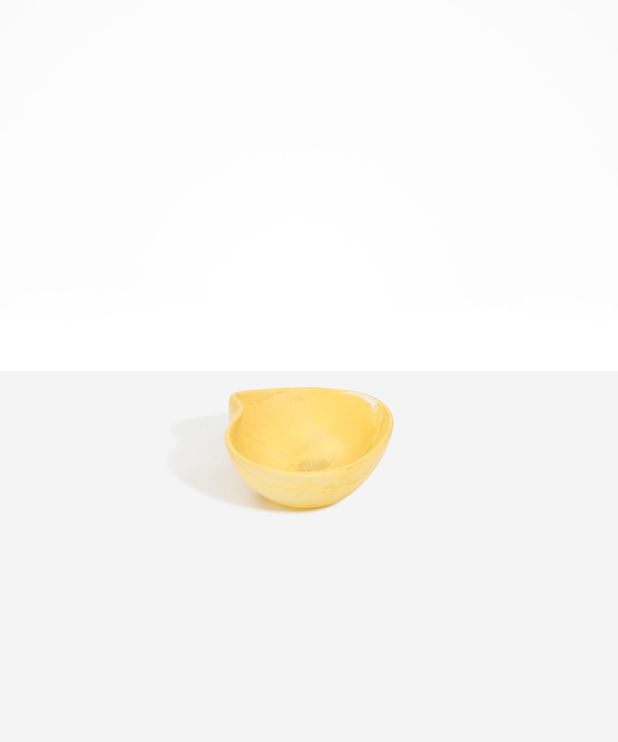 Dinosaur Designs Petal Dessert Bowl in Pollen — handcrafted marbled yellow resin bowl with curved form and pinched organic rim