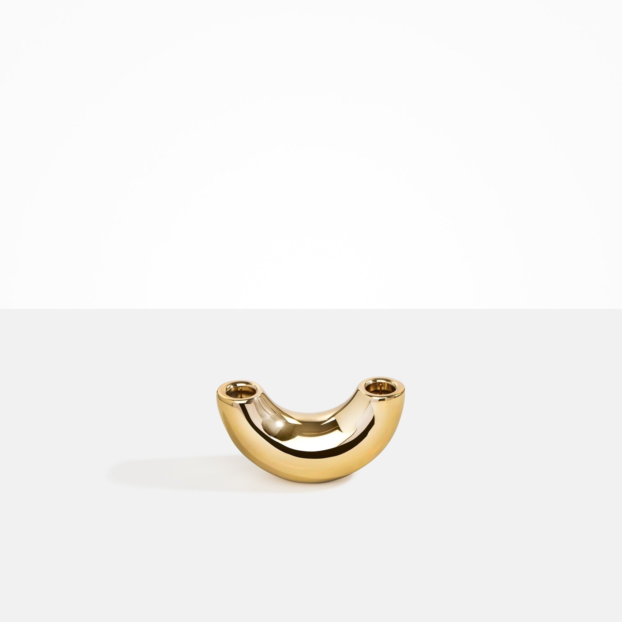 Dinosaur Designs Metal Horn Candlestick Holder in Brass Material..