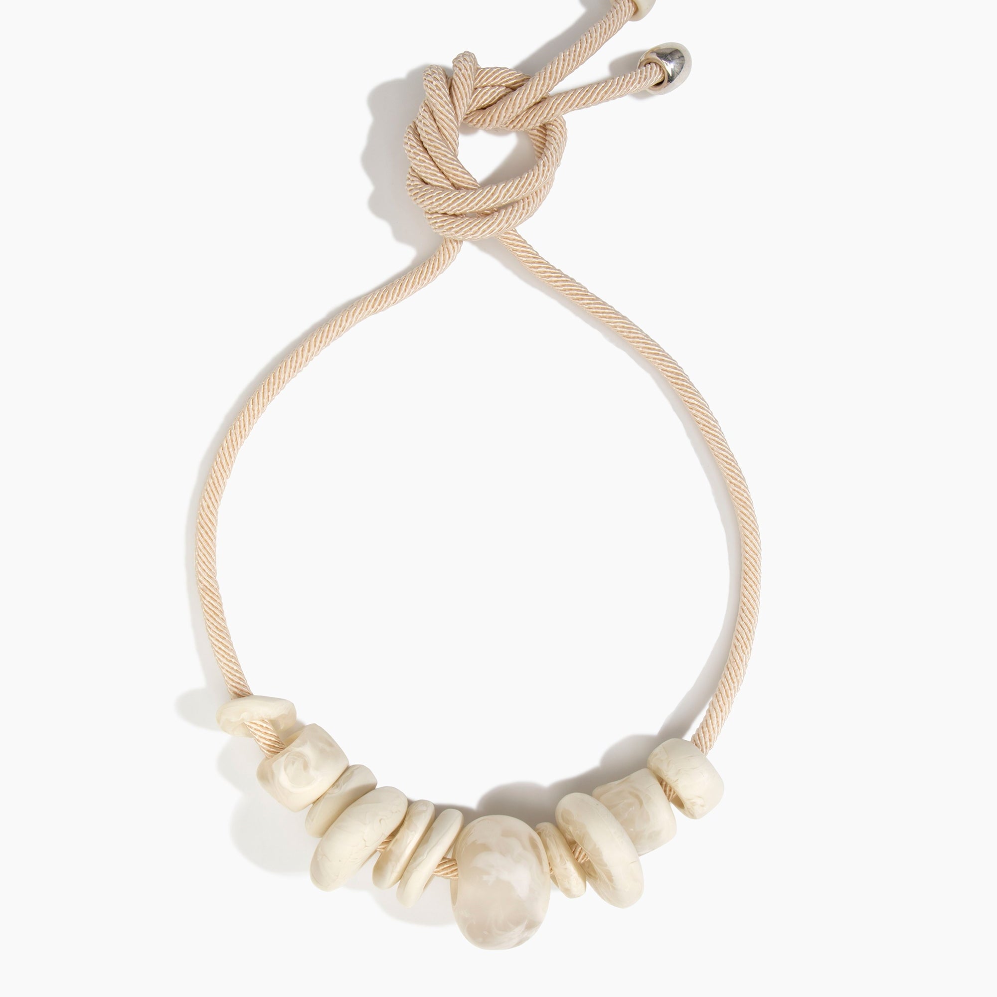 Dinosaur Designs Drift Choker in Chalk Swirl with Plated-Silver — marbled off-white resin pebble beads on a wood silk cord with silver-plated end cap.